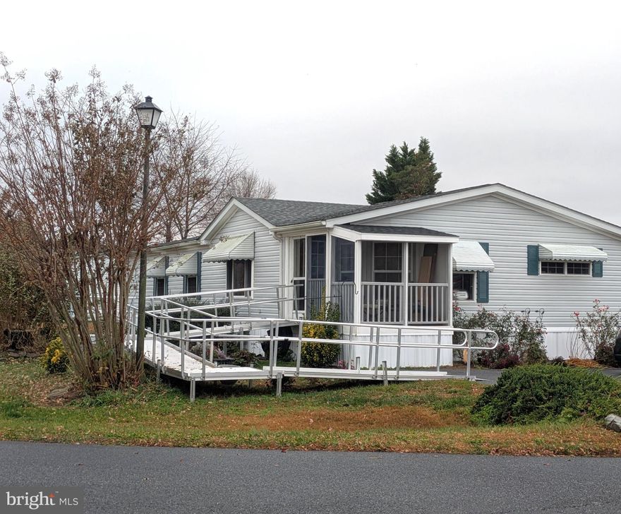 Spacious 3BR, 2BA doublewide in a gated community. Open living area and formal dining room with vaulted ceilings. Updated HVAC system, new skirting, and handicapped ramp system installed in 2024. Roof replaced and new shed in 2021. Community amenities include sewer, water, trash pick-up, road snow removal, swimming pool, basketball court and community activities. 

PROSPECTIVE BUYERS MUST MAKE APPLICATION FOR PARK APPROVAL!