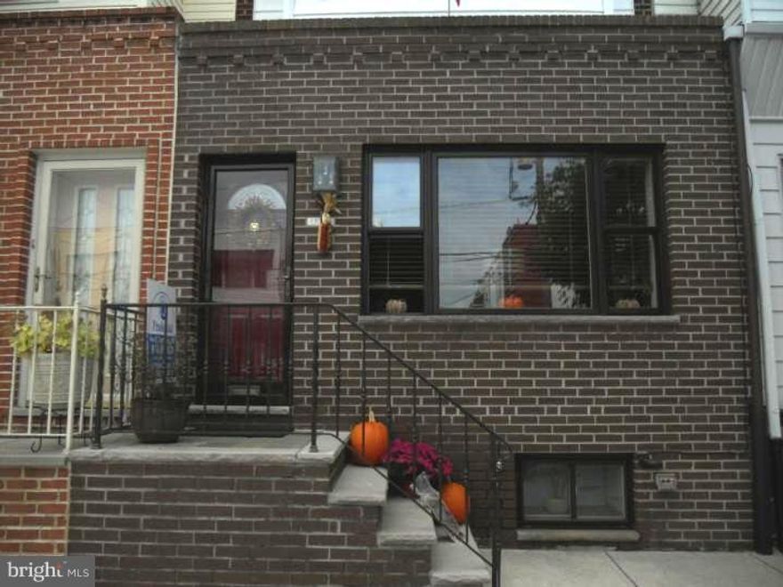 Seriously, this is a pack your bags and move in house. You'll love the 3/4" Brazilian Cherry HW floors thruout, recessed lighting, crown moldings, beautiful iron railings, all newer Pela windows thruout. The eat-in kit. has Corian counters, gas cooking, block glass window that lets the light in while keeping your privacy, refrig, dishwasher & trash compactor are included. The kitchen has an outside entrance that leads to a yard & patio. Sellers made the middle bdrm into a fabulous walk in closet..( they will leave it as-is or remove, as buyer wishes. In addition there's a finished bsmt along with a separate laundry rm & 1/2 bth. The sellers disclosure has additional improvements made by sellers over the last 4 yrs. This home on one of the best blocks in South Philly is close to the park and transportation. Add this one to your tour.