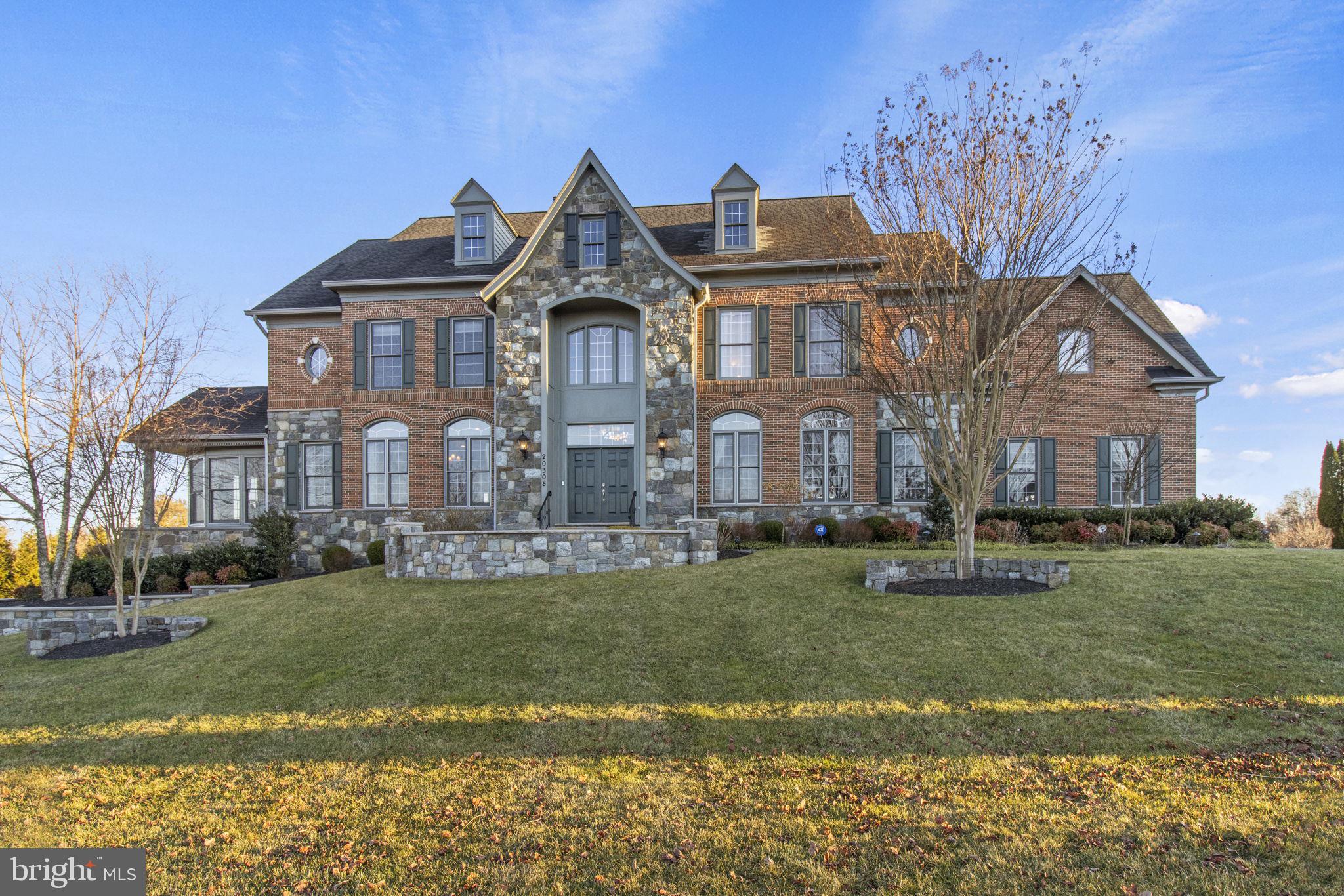 We kindly ask that any offers be submitted by Monday 2/26 by 1pm. Seller's will review and make a decision by end of day Monday. Seller reserves the right to accept an offer before Monday. Majestically situated on 1.50 acres backing to woods, this extraordinary six-bedroom, four level home exudes elegance and luxury. The architectural detail of the ceilings and the elaborate crown molding in the home are enhanced by the gorgeous natural light throughout. One enters the home into an elaborate foyer facing a grand circular stair with wood and wrought iron banister. The elegant living room, dining room, family room, sunroom are all stately spaces for formal entertaining. A main level study provides a quiet, peaceful space. On the first upper level, the lavish owners’ suite is complete with a lovely sitting area, three-sided fireplace and wet bar. The owners’ formal, spa-like bath has a jetted tub, separate shower, and a vaulted ceiling. There are three additional bedrooms on this level, all with ensuite baths and walk in closets. Laundry on upper level as well. The finished second upper level features skylights, a bedroom, and a full bath. The walk-out lower level provides a spectacular space for more informal gatherings, complete with a full kitchen & wet bar. There is also an in-law suite and gym/playroom. And don't forget the cute playhouse/shed out back and the stunning enormous Trex deck overlooking a beautiful backyard. 4 car garage for all of your car enthusiasts. This is truly a home for regal and casual entertaining with its expansive spaces. It is for refined buyers who treasure luxury and privacy in a quintessential country setting.