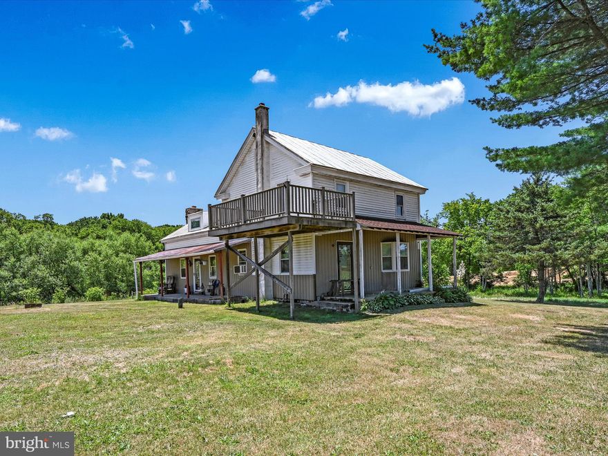 Farmette on almost 13 acres in clean and green with tillable acreage! The home features a newer furnace, an eat-in kitchen with beautiful stone fireplace and wood stove, and views of the mountains and pastures. There's a 4-season room offering stunning views of the fields and pastures, perfect for observing the wildlife. The house also has some replacement windows, a dining room, a primary bedroom with double closets, and a 10' x 15' balcony to enjoy the morning expresso while taking in the amazing sunrises and views for miles, a second bath with main floor laundry, and a walk-up attic for extra storage. Outside, you'll find a 29' x 60' barn and several outbuildings, including a heated garage. The land is currently being farmed and has a stream, ideal for livestock and horses. Multiple wells are located on the property. This farmette is tucked away but, only minutes from Route 183, Route 61, and I-78. This amazing property has so much to offer and will not last long. Hurry before it's too late! Highest and best offers due by Monday July 8th at 7:30 p.m.