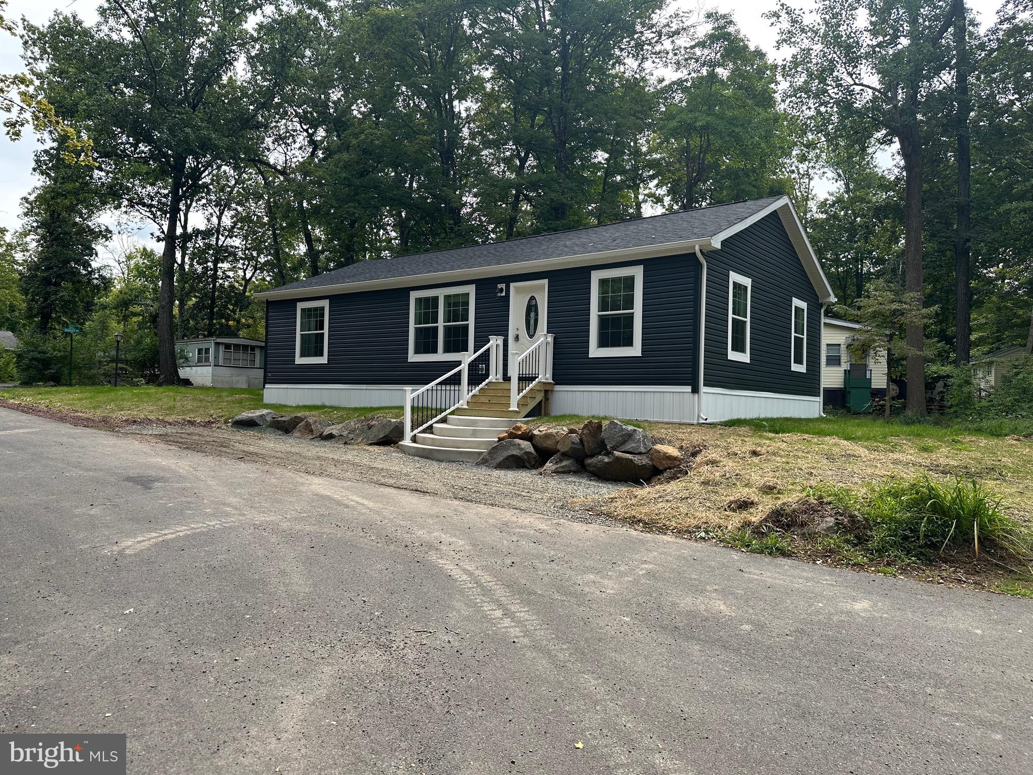 Welcome to this shiny new home on a convenient corner lot . Three bedrooms and 2 baths complete this home that boasts of an open concept ,island kitchen and spa like shower in the primary bath . The land lease of $ 941 /mo includes some water, sewer usage, pool, mini golf, chip and putt, fishing ponds, and use of the community hall for private functions. Park approval required