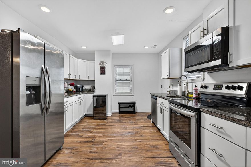 Welcome home to the perfect blend of classic charm and modern convenience on the peninsula of Sparrows Point! Meticulously renovated in 2023, this beautiful two-story home welcomes you with a large covered front porch and an open concept floor plan that seamlessly connects the living and dining areas—ideal for everyday living and entertaining. The gorgeous new kitchen shines with stainless steel appliances, crisp white cabinetry, and granite countertops.  Convenience is key with a  main-level powder room. Upstairs, you’ll find a spacious, updated primary bedroom with a private ensuite, two additional generous bedrooms, and an updated hall bath featuring a double vanity and linen closet. Additional updates include a heat pump and water heater (2023), replacement windows (2021), and a new roof and siding (2021). Outside, enjoy a partially fenced yard and patio area for entertaining.  An unbeatable location just blocks from local restaurants, shopping, schools,  and Haul Road/trails to North Point State Park.  Water oriented community - approximately  8–10 blocks from the Back River.   Easy access to I-695. This is Sparrows Point living at its best.