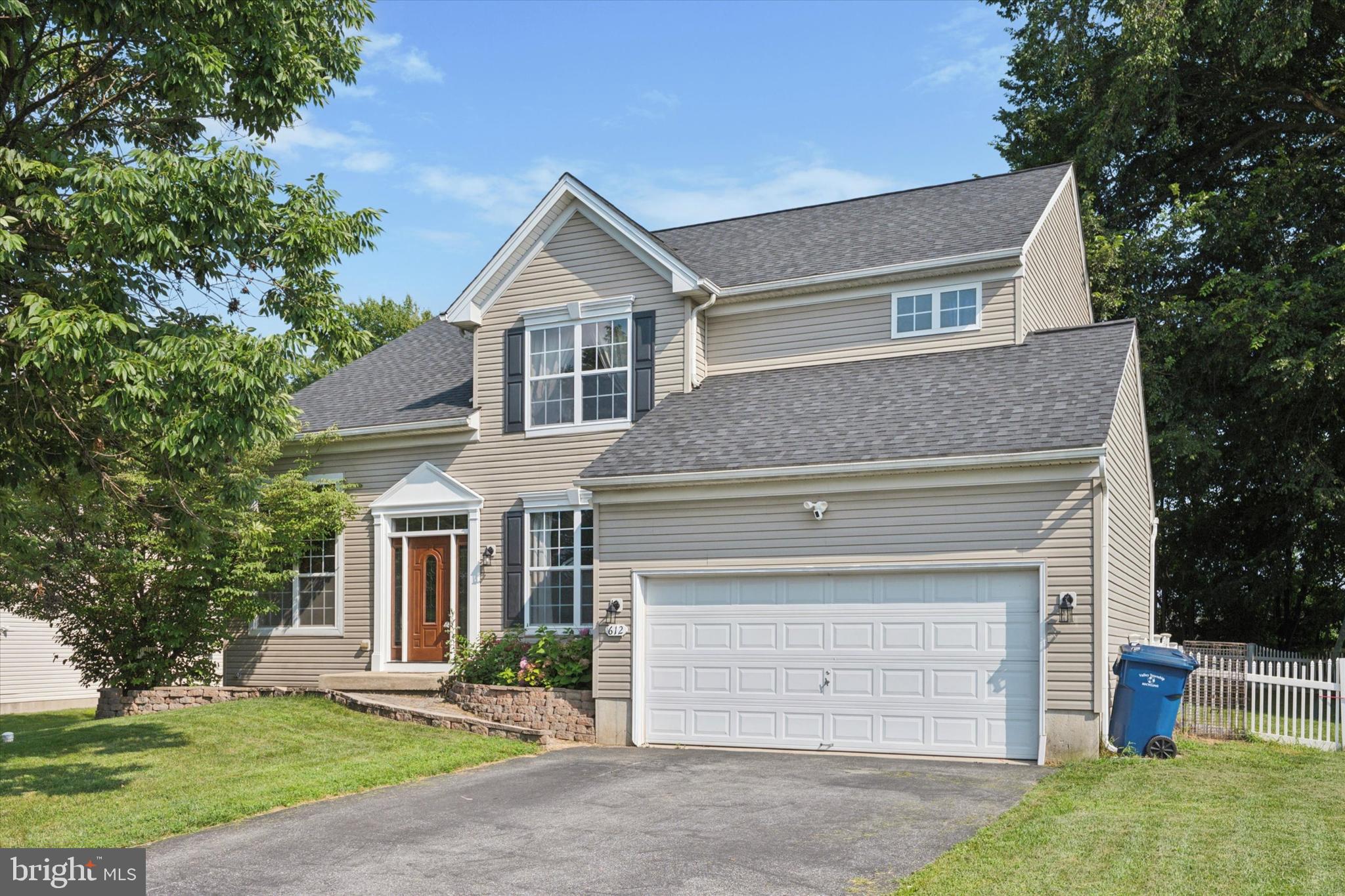 Welcome to 612 Leeward Street, a beautifully appointed single-family home in the sought-after Meadowbrook community of Valley Township. Thoughtfully updated and maintained, this spacious home features a decorative retaining wall with lush perennial beds that creates a charming first impression as you step into the bright two-story foyer, flanked by a formal living room with soaring ceilings and a dining room enhanced with crown molding and gleaming hardwood floors. The hardwood continues into the inviting family room, where a marble gas fireplace with wood mantle serves as a cozy focal point. The well-equipped kitchen boasts cherry cabinetry, a center island, stainless steel appliances, glass tile backsplash, custom leaded glass pendant lighting, and a butler’s pantry, all opening seamlessly to the sun-drenched Morning Room—ideal for hosting large gatherings. Step through the sliding doors to the composite deck with pergola, and a vinyl picket fence surrounding the backyard—perfect for both relaxing and entertaining all while enjoying your private fenced yard. The highly desired Morning Room addition, main-level laundry room with garage access and a powder room add to the home’s functionality. The tucked-away turned staircase leads to the upper level, where you’ll find the spacious primary suite featuring his and her walk-in closets, a ceiling fan, and an updated en suite bath with double cherry vanity, ceramic-tiled shower, and soaking tub. Three additional bedrooms, each with ceiling fans, share a well-appointed hall bath. Fresh paint and updated lighting throughout give this home a modern, move-in-ready feel. Located in a quiet loop of the community with access to walking trails and a playground, and just minutes to Rainbow Elementary, the Route 30 Bypass, and Amtrak/SEPTA regional rail stations.
