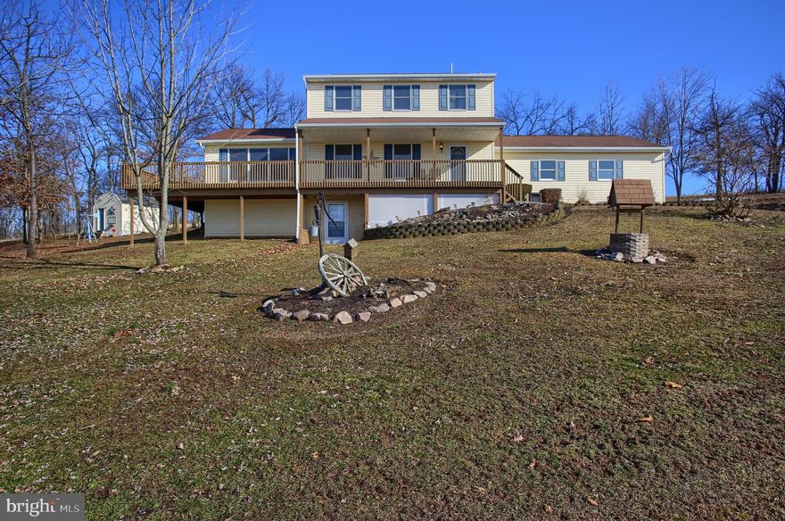 This beautiful home has fantastic views and sits on just over 4 acres of land. Enter the home through the front door and walk through the living room, glancing out the front windows noticing the purple mountains. Then walk to the formal dining room with access to the eat in kitchen. As an extra special bonus to this home there is large family room for an added space. The upper level includes all 3 bedrooms and 2 full bathrooms. Large deck, 2 car attached garage, and a peaceful setting, this property is waiting for its new owners!