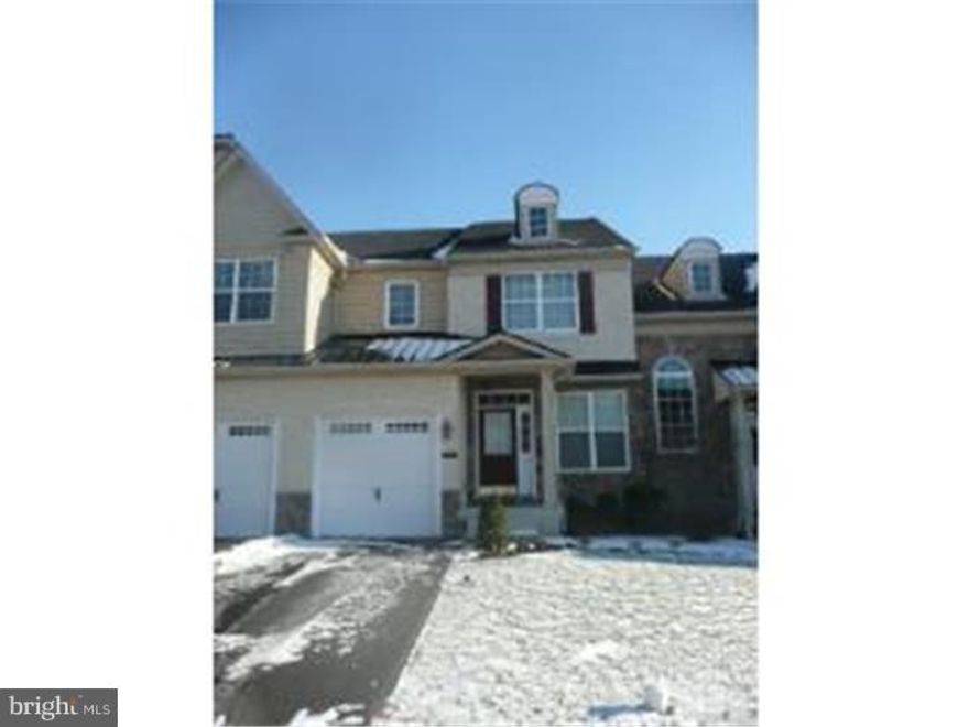 6 year old townhouse in Heritage Center.  Like new. Hardwood entry. Formal living room with crown molding. Dining room. Family room with hardwood floors and gas fireplace with hi-hat lighting. Beautiful eat-in kitchen with granite countertops, stainless steel appliances, double oven, built-inn microwave with sliding glass door to outdoor deck.  Main bedroom with tray ceiling with master bath with stall shower and soaking tub, walk-in closet and sitting area.  Two other bedrooms with tray ceilings.  Laundry closet on second floor. Basement ready for finishing touches.  The basement ceiling is drywalled, painted with lighting.  Roughed in plumbing is also in the basement.