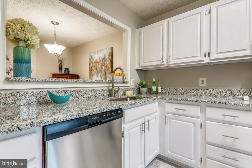 BACKS TO FOREST JUST OFF 495/66/50 CONTRACTS TO AGENT (via BLUREALTOR@AOL.COM) MONDAY EVENING, THANKS Ample Guest spots on the left or park in #55 in front of the condo.  Spacious (almost 1200 sqft) 2nd level condo boasts a wall of windows in the sunroom. - see the trees! The sunroom  walks out to the covered deck overlooking a forest of mature trees & year round creek.  Wildlife abounds w/deer,  ducks, squirrels and even a red fox call this natural oasis  home.  While walking through you'll see that all windows have incredible views.  Sipping your morning coffee you may find your "nature buddies" planting acorns in the Fall or sitting on nests hatching ducklings in the Spring. Most residents, have at some time, been stopped on Jaguar Trail while the Mom Duck leads her duckling to Lake Sequoia.  The kitchen was just remodeled and we think it would satisfy any chef's wish list, not only because there is gas cooking but because of all the bells and whistles. The  Stainless Steel Appliances  are offset by the upgraded granite countertops, lovely vinyl tiling and white cabinets. There's a Custom Designed bar that for more storage plus seating.  All the light fixtures were selected with care.  You will want to remove your shoes so your toes can sink into the upgraded carpet (& extra thick padding). The kitchen pass through to the dining room makes entertaining an ease. The dining room can be set for formal dining or arranged to serve as a dining/living room combination.  The dual entrance (16 ft) bathroom has a jetted tub/shower, linen closet, cultured marble vanity plus full size washer/dryer are behind closet doors.  The master suite w/the huge walk-in closet + custom shelving -  will surely delight.  The second bedroom can make a wonderful home office or be a guest room (or both as set up presently).  Plus the sunroom can make a great relaxing home office too!  The condo fee is 381/month and covers:  water, sewer, trash & snow removal, out door swimming pool, assigned parking, master insurance policy (let your loan officer know we have HOC6) will save you on your insurance.  All exterior and lawn maintenance are covered in the condo fee too. Listing agent is a resident so feel free to text with any and all questions.  Nearby Mosaic District is loaded w/boutiques, dining and movie theatre (presently closed).See Pictures for floor plan - agent happy to answer questions) LITERALLY A STONES THROW TO PROVIDENCE REC CENTER & THEIR INDOOR POOL!  (OPEN BY RESERVATION)