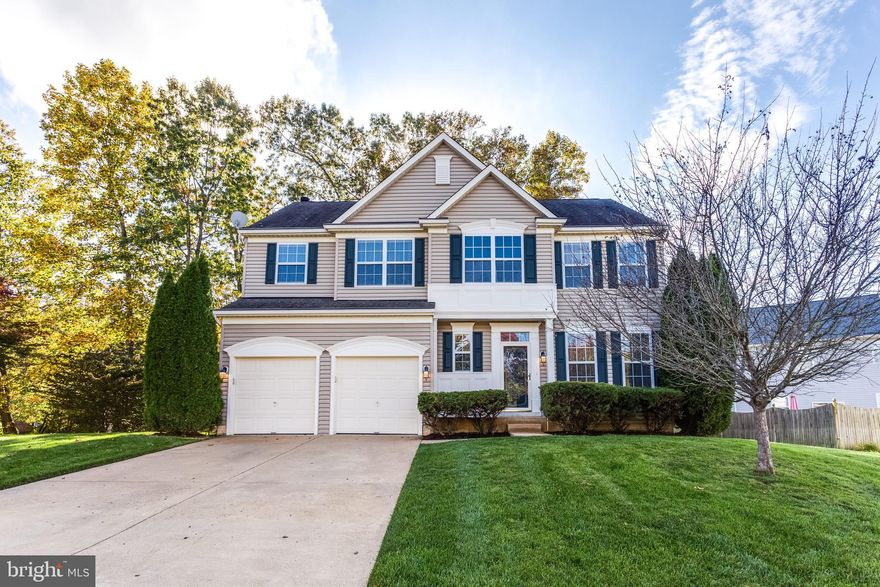 GRACEFUL AND ELEGANT Colonial on quiet cul-de-sac with nice detailing is ready for you to move right in!  This beautiful home features a dramatic 2 story entry foyer with a stylish open staircase, plant shelves and crown moldings. There is fresh paint throughout this lovely home as well as brand new carpeting. The main level has gleaming hardwood floors. The kitchen has a convenient island (great for entertaining) and appliances are only about 3 years old! The formal dining room features both crown molding and chair railing. There is a nice bay bump-out in the kitchen that leads to the deck on the rear of the home to expand your entertaining space to the outdoors!  The laundry is conveniently located on the upper level. The Primary bedroom with double door entry has 2 large walk-in closets and the Primary bathroom features a huge soaking tub, separate shower and separate vanities. All of the commodes have been replaced throughout this home as well. The window blinds are brand new on the entire upper level.  There are gutter helmets on the rain gutters and an in-ground sprinkler system to keep your landscape nice! The unfinished basement is ready for your own finishing touches.  It does have a sump pump and a 3-piece roughed in bathroom for your convenience. This home is conveniently located for an easy commute to Washington DC, the National Harbor, Northern Virginia, and Joint Base Andrews and Boling. Do not miss this one!