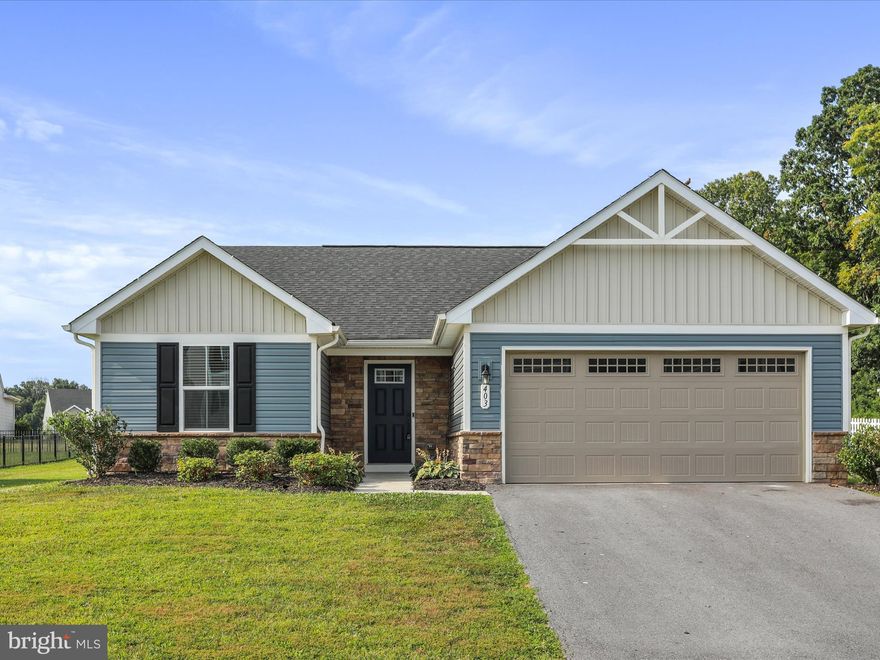 Discover this charming, single-level rancher in the sought-after community of The Lakes at Martinsburg! This beautiful  home sits on a picturesque lot and features a bright, open-concept layout perfect for modern living. The spacious kitchen, dining, and living areas flow seamlessly together, highlighted by granite countertops, stainless steel appliances with gas cooking, recessed lighting, abundant cabinetry, a pantry, and stylish luxury vinyl plank flooring. Sliding glass doors lead to the backyard, making indoor-outdoor living a breeze. The primary suite boasts a walk-in closet and a private bath with a stall shower, while the conveniently located laundry room sits just outside the bedroom. Two additional bedrooms and a full bath are tucked away on the opposite side for added privacy. Enjoy the convenience of a two-car attached garage and a paved driveway.  An excellent location for Maryland commuters! Don't miss your chance to own this wonderful home!