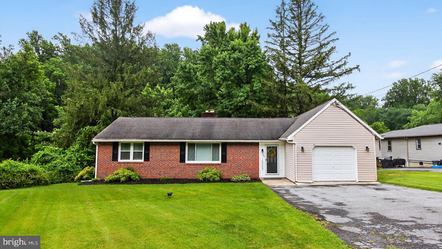 Come see this beautiful brick rancher located on a quiet street. On the main floor it has 3 bedrooms, full bathroom, living room with fireplace, kitchen, dining area, hardwood flooring throughout, and more. The walk out basement has a spacious family room, half bathroom, and office/bonus room. The back yard offers a nice large deck with serene, private views, and additional 0.14 acres where a stream is located. There is lots of storage in the attached 1 car garage and shed.