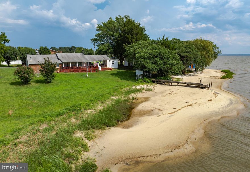 Your Private Waterfront Retreat awaits!
Nestled on .85 acres of serene, natural beauty, this special property offers a rare opportunity to enjoy a true beachfront lifestyle. From the moment you arrive, you’re surrounded by nature and tranquility. Throughout the seasons, you’ll witness an abundance of wildlife right in your backyard – from graceful bald eagles and osprey to deer, geese, and countless other native species that call this area home.
Step out onto your deck and take in the sights and sounds of the Potomac River. Spend your evenings gazing at the stars and listening to the gentle lapping of the water as you unwind from the day. This is more than a home….it’s an experience.
The current owner has cherished this property since 1998 and has loved every moment of life here. Inside, you’ll find a spacious 23’ x 24’ family room that provides ample space for friends and family to gather and make memories.
Step down to the water and experience the beauty and versatility of this ever-changing beach. The shoreline shifts with the tides, providing a unique and dynamic waterfront view every day. Launch a canoe, kayak, or stand-up paddleboard right from your beach and glide out onto the Potomac River. If fishing is your passion, you’ll be delighted to know that the perch are plentiful and ready for your next catch!
Whether you’re seeking a quiet place to relax, a space for water sports, or a serene spot to watch the stars dance across the sky, this property has it all. Come experience the best of waterfront living at Bowles Road, where every day feels like a vacation!