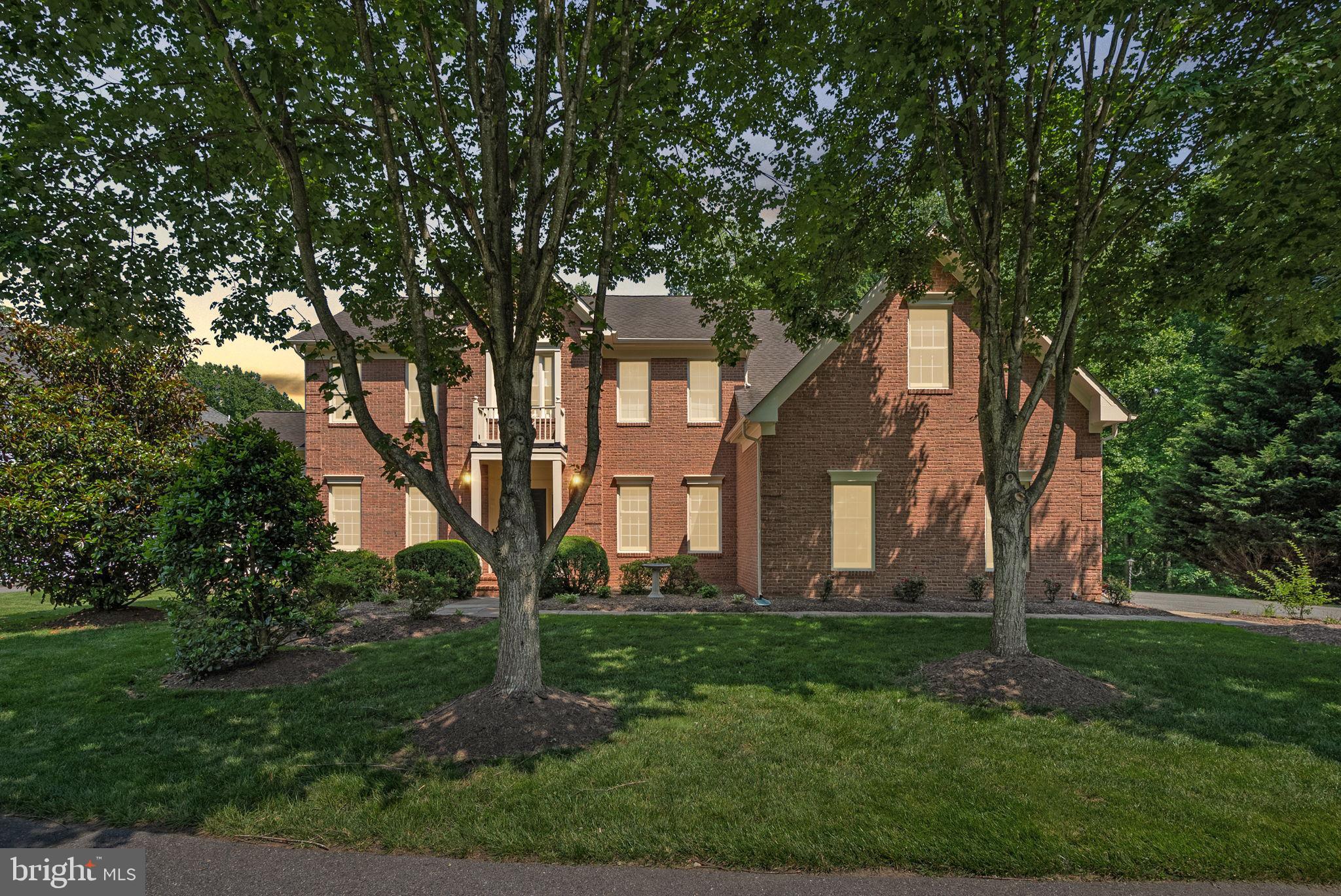 RARELY AVAILABLE IN THE RESERVE, FIRST ONE ON MARKET SINCE 2023! PRIVATE OASIS BACKING TO ALMOST 20 ACRES OF PRESERVED PARKLAND. OVER 6,400 SQ FT OF ELEGANT LIVING SPACE ON A PRIVATE CUL-DE-SAC. GOES TO OLNEY SCHOOLS! Welcome to 301 Reserve Gate Terrace, an extraordinary residence nestled in the highly sought-after Reserve section in the Ashton Preserve community. Lightly lived-in and meticulously cared for by its original owner, this impressive Brookline model is positioned on a beautifully landscaped .38-acre lot that backs to an expansive, roughly 20-acre wooded preserve—offering the rare combination of privacy, views, and tranquility.
With more than 6,400 square feet of finished living space across three thoughtfully designed levels, this 5-bedroom, 4.5-bathroom, 3-car garage estate delivers elegance, functionality, and modern sophistication at every turn. From the moment you step through the grand two-story foyer, you’re greeted by rich hardwood flooring and soaring ceilings, setting the tone for the refined finishes that follow.
The main level boasts a formal living and dining room, a full-sized private office overlooking lush greenery, and a breathtaking two-story family room centered around a beautiful fireplace. Natural light floods the sunroom addition, featuring floor-to-ceiling windows on three sides and scenic views of the backyard. At the heart of the home lies the gourmet chef’s kitchen, with gleaming stainless steel appliances (1 year old), granite countertops, double oven, a large island with 5-burner cooktop, butler’s pantry, and oversized sink framed by windows that offer peaceful views of the treetops beyond.
Upstairs, you’ll find four generously sized bedrooms, all with hardwood flooring. The primary suite is a true retreat, complete with a separate sitting room, bedroom-sized walk-in closet, and a luxurious bath featuring dual vanities, soaking tub, and separate shower. A guest suite with its own full bath and two additional bedrooms connected by a Jack-and-Jill bath complete the upper level.
The fully finished walk-out lower is nearly 2,500 square feet and includes a dedicated media room, bedroom with full bath, second family room with fireplace, and multiple recreation and flex spaces perfect for entertaining, fitness, or play. Dual-zone HVAC system was updated in 2016.
Step outside to the custom Trex deck with a charming gazebo, ideal for dining al fresco while surrounded by the serenity of mature trees.
The home is located in a private cul-de-sac featuring a charming community green space with gazebo and sitting areas. Just 10 minutes to downtown Olney, this residence is a rare offering in a neighborhood where homes are rarely available.
Don’t miss your opportunity to experience luxury, space, and serenity all in one unforgettable address.