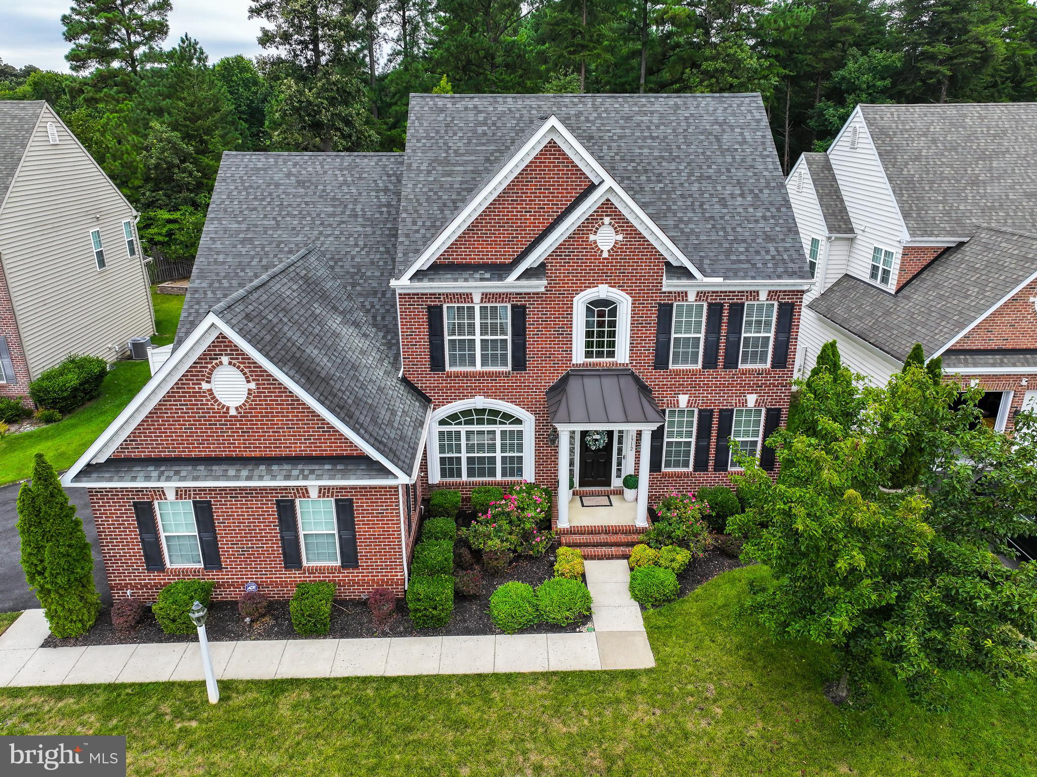 Welcome to 1712 Veronica Way, Severn – a stunning brick-front Colonial offering elegance, space, and modern convenience in a prime location. Impeccably maintained and boasting 4,338 square feet of total space, this residence is designed to impress at every turn.
Step inside the grand two-story foyer, where gleaming floors and abundant natural light set the stage for the home’s refined style. The main level features a formal dining room, a formal living room, and a private home office-perfect for today’s flexible lifestyle. The heart of the home is the gourmet island kitchen, appointed with upgraded cabinetry, countertops, and stylish finishes. Flowing seamlessly into the spacious family room with a cozy gas fireplace, this open layout is ideal for everyday living and entertaining.
From the bright sitting area, step out to your own private retreat: a fenced-in backyard with upgraded hardscaping, a lush green lawn, and a built-in underground irrigation system to keep it beautifully maintained year-round. The expansive yard is perfectly suited for hosting gatherings, family fun, or simply relaxing outdoors.
Upstairs, discover four generously sized bedrooms including a luxurious owner’s suite with vaulted ceilings, dual walk-in closets, and a spa-like bath with dual vanities, a soaking tub, and separate shower. A conveniently located laundry room on this level makes daily routines effortless.
The fully finished walkout basement offers endless possibilities-featuring a dedicated home gym, a full bath, two storage rooms, and an open recreation space ideal for a game room, media lounge, or man cave.
Car enthusiasts and hobbyists alike will appreciate the rare three-car garage, providing exceptional storage and workspace.
For added peace of mind, all gutters around the house are sealed with Leaf Filters Advanced guards with lifetime warranty, eliminating fall clogging issues and the need for owners to climb ladders for cleaning.
Set on a quiet cul-de-sac in a welcoming community, this home offers peace and privacy while being just minutes from Anne Arundel Mills, BWI, Ft. Meade/NSA, and major commuter routes (295, 95, and 100) for easy access to Baltimore, Washington, and beyond.
The house is owner occupied, please wear the shoe covers provided.