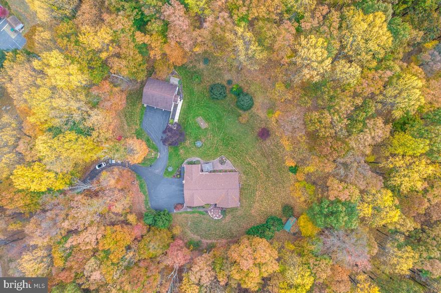 Privacy abounds!  Great opportunity to own this amazing brick and vinyl ranch with 3 bedrooms, 2 ½ baths on 4.33 acres in the Twin Valley School District!  Imagine watching the deer from your covered front porch or very large back patio.  The very spacious living room comes with crown molding and hardwood flooring, as well as the lovely, formal dining room. The kitchen has tons of cabinets and countertop space along with a peninsula for extra seating.  The family room is quite cozy with a brick fireplace, hardwood flooring and crown molding and has access to the large 3-Season sunroom with access to the rear yard.  Spacious primary ensuite with a brand new, gorgeous primary bathroom for relaxation and includes a tile surround shower and crown molding.  Two additional spacious bedrooms, one with a walk-in closet and a newly remodeled hall bath as well and a large mud room with laundry sink..   There is lots of room for storage in your attached, oversized 2-car garage and additional storage in the lower level.  The 2nd home has 2 bedrooms and 1 full bath, with a double vanity, and is 1,640 sq. ft. and comes with a 3-car attached garage, two cars deep, it’s own driveway and address. It has a cathedral ceiling, large kitchen with recessed lighting and a breakfast area.  Each home has its own septic tank, shared drainfield and well (per township regulations).  The property is close in proximity to all major highways.