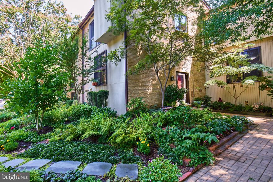 Gardeners Paradise!  Split Foyer Canterbury unit in sought after Chesterfield Mews, in rare partial cluster facing the wooded parkland perimeter of the community!  Carefully planned and tended landscaping wraps around the front corner of the property and including an elegant bluestone path making for a streamlined trip to and from the units reserved spaces.  Enter into the dramatic, 2.5 story foyer, the half flight separation from the main  and lower levels makes it a true receiving area and brings added light into the English Basement, while fabulous views from the second story window can be enjoyed from the dining room as well as the upstairs landing!  Up the half flight of stairs puts you in the full sized dining room, bordered by the pristine kitchen, featuring a large eating space with and cavernous pantry space, is to the left, overlooking the front landscaping.  To the right, the large living room, complete with wood burning fireplace,  spans the full width of the house and opens to the beautifully hardscaped backyard paradise, views of which can be enjoyed through the ample windows!  More carefully planned landscaping can be found on either side of the back fence.  At the side edge of the patio, the "utility area" is disguised by a low fence, long enough to leave room for trash containers, etc.  With a fabulous lower level rec room, enhanced by it's ground level view of the front garden, and well organized wall closets (and additional storage) just a half flight from the foyer, the possibilities are endless.  Upstairs, with it's newly installed premium carpet, you'll find the peaceful primary suite, with en-suite walk-in shower, amazing medicine cabinets and customized walk-in closet, It's custom accordion vertical insulated shades keep the room cozy and dark!  Both front bedrooms, feature horizontal honeycomb insulated blinds, as well as the window above the front door,