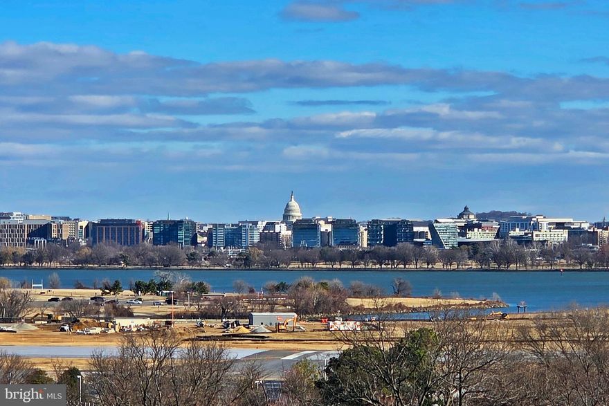Discover sweeping views of the U.S. Capitol, Jefferson Memorial, and Potomac River from this light-filled 9th-floor residence in the heart of National Landing. Sold as-is-condition - many original features - ideal for buyers wishing to update and personalize to their taste, well worth the effort with this expansive view. Spacious 2br./2ba. residence, with 1,224 sq. ft of living, features oversized windows, abundant natural light, a generous primary suite with ensuite bath, and an additional full bath.  Hardwood floors in the living / dining areas. Two garage parking spaces and a private storage unit convey. The building offers a full suite of amenities, including a fitness center, outdoor swimming pool, sauna, party room, billiard room, and 24-hour security with a monitored entry desk. Urban convenience at its finest—just one block to the Crystal City Metro. A stone’s throw to Amazon HQ2, Westpost at National Landing, and a wealth of dining and shopping options. Minutes to the Pentagon, Pentagon City, and Reagan National Airport. A rare opportunity to create your dream condo in one of the area’s most dynamic and connected neighborhoods.