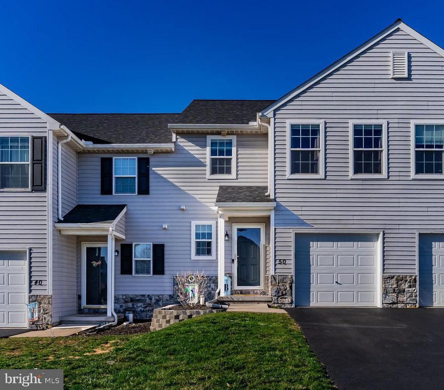 Welcome home to this well maintained EGStoltzfus-built townhome in the desirable community of Locust Run. Built in 2017, this home boasts durable LVP flooring upon entry leading into a spacious open-concept kitchen, dining and living area. Perfect for entertaining. The kitchen is a cook’s delight featuring espresso cabinetry, smooth-top counters, stainless steel GE appliances, a newer dishwasher, and an elegant Italian marble backsplash. Sliding glass doors lead to the outdoor deck, complete with an optional sunshade, grilling pad and a fully fenced-in yard with durable vinyl fencing, ideal for relaxation, outdoor gatherings or for your furry friends. Upstairs, the primary suite offers a large walk-in closet, Harbor Breeze overhead fan with lighting and a private ensuite bath with oversized vanity, vinyl flooring and a shower/tub combo with a bench. Two additional spacious bedrooms include impressive closet space and overhead lighting/fans. The convenient second-floor laundry makes everyday chores a breeze. Upgraded window treatments throughout, including blackout blinds in the primary and guest rooms. The lower level is ready for your finishing touches featuring Superior Walls, a sump pit/pump and energy-efficient gas heat. Tech lovers will appreciate the included Ring security system complete with a doorbell, door and window sensors, home hub, door chime, and alarm keypad. Additional highlights include a one-car garage with overhead storage plus paved off-street parking just a few doors down. Located in the Northeastern York School District, this home offers quality, comfort, and convenience. Call today to schedule your own private tour or join us at our open house this Saturday from 10AM - Noon.