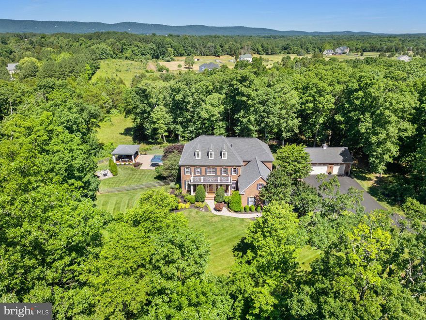 *Welcome to resort style living in Haymarket*Located on 10 private acres, this beautifully maintained colonial has over 6000 square feet of luxuriously finished living space*In addition to a 3 car side load garage, there is also an oversized 3 car detached garage perfect for the car enthusiast or fitness junky*If outdoor entertaining is your passion, check out the 20 x 40 heated saltwater pool with cabana/pool house & expansive patio with koi pond/waterfall, tiered decking, screened in gazebo, retractable awning and so much more*Greet your visitors in the center hall flanked by formal living & dining rooms*Great room with gas fireplace & coffered ceilings*Main level office*Gourmet kitchen with huge island, walk-in pantry & rear sunroom/eat in area*Upstairs you'll find the primary suite with tray ceiling & cozy sitting room with gas fireplace*Renovated primary bathroom with double vanities, soaking tub, shower, water closet & dual walk-in closets*Two large bedrooms share a jack-n-jill bathroom*Additional en-suite completes the upper level*Finished walk-out lower level with spacious recreation room overlooking patio*Theatre room (equipment & chairs convey)*5th bedroom with walk-in closet & full bath*Additional room would make a great den or exercise room*Model home worthy - all you need to do is move in!!*