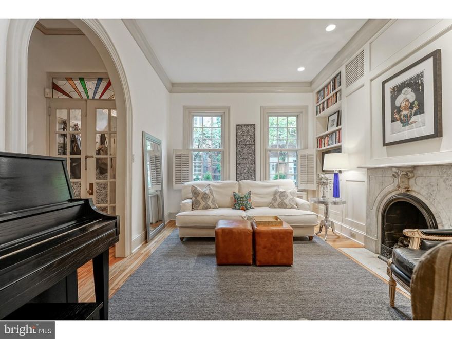 Built in 1850 on coveted Delancey Street, this 3 bedroom plus den and 3 full bath home has been completely updated while preserving the property's historic charm. Southern facing and situated on the end of the block, this home has endless natural light!  Beautiful, well-maintained window boxes and royal door knocker provide major curb appeal. Enter the foyer through the double doors, leading you into the open concept first floor that is perfect for entertaining! Enjoy the gas fireplace surrounded by marble in the expansive living area. This area flows beautifully into the grand dining room which has floor to ceiling built in storage and a custom built-in desk. The large eat in kitchen features heated floors, a Viking chef grade gas stove, island with breakfast bar, custom built in bench with storage and skylights. Right off the kitchen you will find sliding glass doors leading you out to a wonderful brick-paved courtyard with manicured gardens. The courtyard is equipped with watering system, lighting, fountain and natural gas line for grill. Fully finished basement works perfectly for a media room, complete with a wet bar, another built in bench and closets for more storage. The nursery/den, full bath and ensuite Master round out the second floor.  Master Suite is fabulous with a walk-in closet and pristine white marble bathroom with glass enclaved shower, separated by a beautiful sliding barn door. Upstairs on the third floor, you will find two more bedrooms with great closet space, ultra-lux full bath, linen closet and a secluded deck space with skyline views!  Owners have extensively restored the trim and plaster walls throughout. Dual zoned A/C, alarm system, wired for Sonos sound system, immaculate hardwood floors and amazing storage throughout - this home is not to be missed! Move in ready, don't miss the chance to maximize your living on one of the most prestigious blocks in Rittenhouse square! Located in the Greenfield catchment, just steps to many cafes, restaurants, shops, bars, parks, and only a few blocks from the Schuylkill Trails and Schuylkill River! Square footage total is 2500 sq ft, per most recent appraisal report on 3/24/2014.