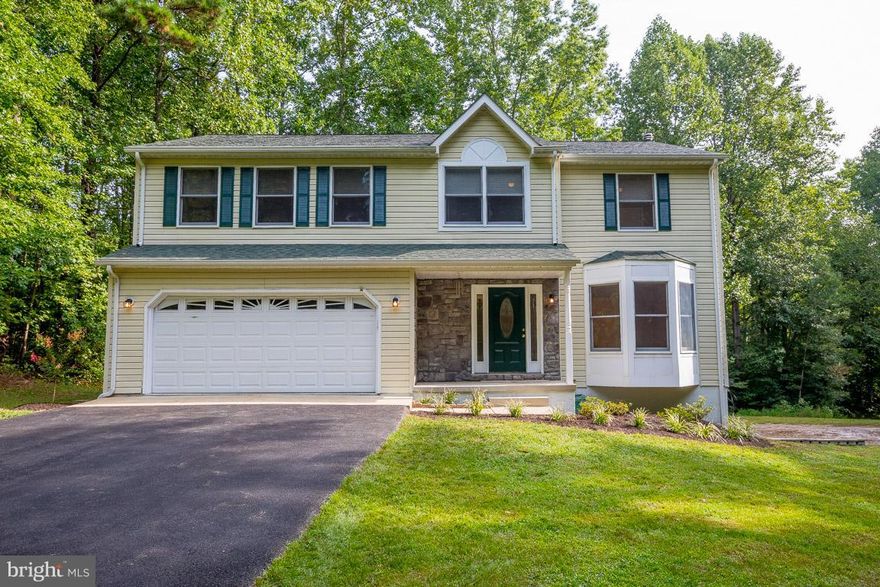 Pack your bags...this one won't last long! 4BR 3.5BA Colonial situated on over 4 Acres. Kitchen with breakfast area...overlooking family room with stone surrounded wood burning FP. LARGE mstr suite w/WIC, updated lux bath (to include soak tub, dual sinks & sep shwr) & private balcony. 2 tiered deck is perfect for entertaining. All new carpet, freshly painted, updated dual zone heat pump. No HOA!