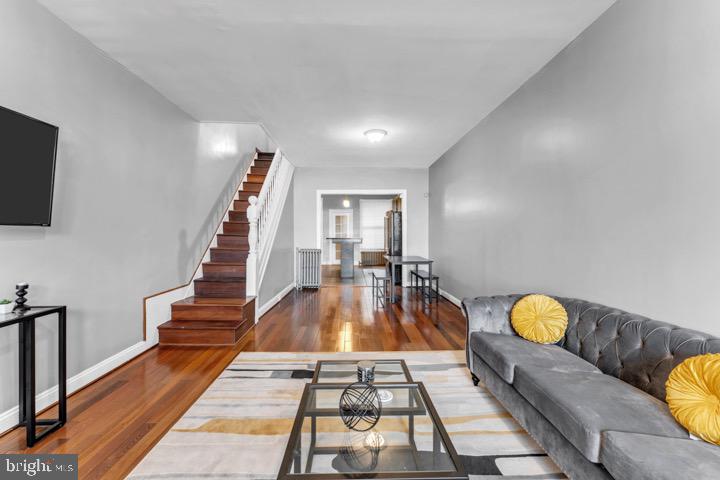 ***Plenty of city grants available****Welcome to 621 N Linwood Ave, in the sought out Elmwood Park neighborhood. This well maintained home is spacious , has hardwood floors and plenty of natural lighting. On the first floor you're greeted by a spacious living room that flows seamlessly into a private dining area—perfect for hosting dinner parties or enjoying intimate family meals. The kitchen is a chef's dream, it has an Island with bar seating, and plenty of cabinetry, with convenient access to the backyard. Upstairs, you'll find three generously sized bedrooms, each offering ample closet space and a full bathroom. Come see this home and make it yours! It is being sold completely as is. Schedule your showing today!