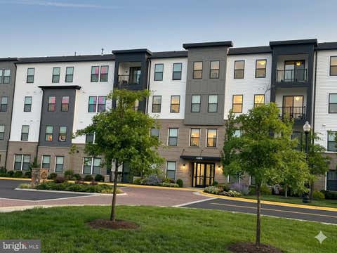 Photo of 42874 Firefly Sonata Terrace #403, ASHBURN, VA 20148 (MLS # VALO2131344)