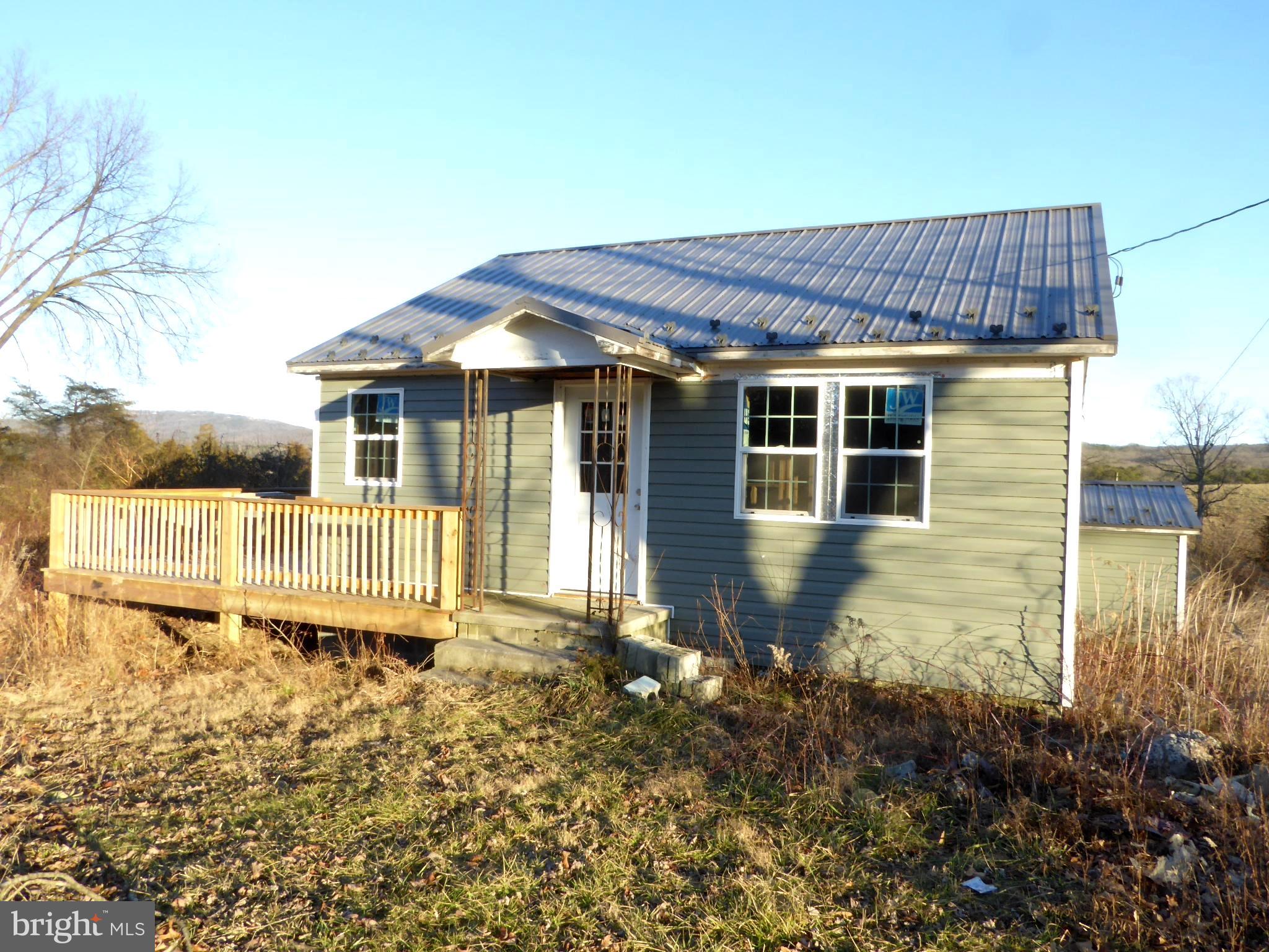 !!!JUST REDUCED!!! UNRESTRICTED!!! L OOKING FOR A HOME YOU CAN FINISH THE WAY YOU WANT? THIS IS IT!! NEW SIDING, WINDOWS AND SIDE DECK. INTERIOR IS STUDDED UP AND ELECTRICAL STARTED. HOUSE FRONTS STATE MAINTAINED BLACK TOP ROAD WITH PUBLIC WATER AVAILABLE. CALL NOW FOR AN APPOINTMENT.