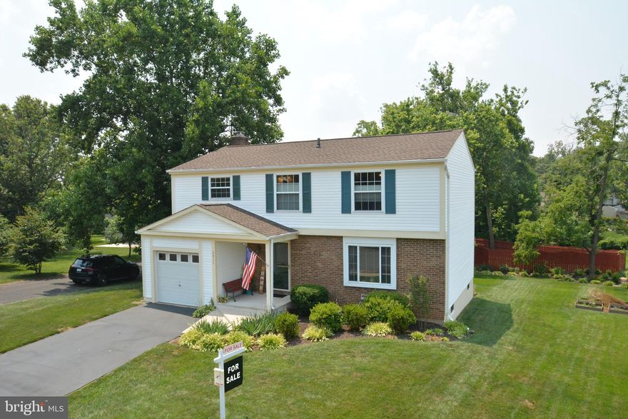 Gorgeous sun-drenched, move-in ready, 4BR, 2.5BA Colonial with a covered front porch on a Level 1/4 Acre lot.  Home is at the top of a pipe-steam in the sought-after community of West Ox Cluster (Fox Run).  This home has been beautifully updated and meticulously maintained and is in great condition!   Lovely covered front entrance opens to foyer area on the main level.  Access to the updated powder room is just off the foyer.  Wood look laminate flooring starts in the foyer and covers the entire kitchen and family room;  Carpet in the living room and dining room (dining room currently being used as a music room).  Chair rail and picture frame trim accent the Dining/Music Room. Recessed lighting in kitchen highlight the Granite counter tops throughout the kitchen.  The subway tile back splash brightens the entire kitchen.  36” KraftMaid cabinets; Bridgewater Cathedral fronts w/Praline finish; two tier silverware drawer. All drawers are soft close. Two Lazy Susan cabinets in corners, slide out/recessed trash and more than ample storage with a floor to ceiling pantry.  Appliances:  Kenmore side by side white refrigerator with filtered water and ice on door, KitchenAid Dishwasher, Kenmore built in microwave and Whirlpool smooth top range with the touch of a button.  Sliding glass door with integrated blinds from the family room leads to large deck that overlooks a lush, level back yard.  The Sunair automatic awning provides you shade when you need it or sun when you want it.  Garden area already exists in ground just in time for your late spring garden.  Wall-to-Wall carpeting throughout the entire second level.  Spacious Master Bedroom has ceiling fan, Vanity & Walk-In Closet. Master bath has new Floor to Ceiling Tile shower, new door and new shower head.  Bedroom 2 has a generously sized closet with ceiling fan.  Bedrooms 3 and 4 are adjacent to the upgraded full bath in the hallway. Hall Bath has new Ceramic tub and floor to ceiling tiles with new shower head.  Recessed lighting brighten the Rec Room/Office/Workout area in the basement.  Wall-to-wall Berber carpet accent the Wall-to-wall built in bookshelves/cabinets which provide more than enough room for all your books, pictures or display items.  A second floor to ceiling double-door Pantry in basement provides another much desired storage area for food or other items. The unfinished part of the basement is where the laundry area exists which contains a laundry chute from the second floor.  An easily accessible crawl space provides easy access for storage of those items you don’t use every day.  Standard one car garage.  Short drive to  the Wiehle-Reston East Silver line metro station.  The Herndon Silver line stop will be even closer once phase 2 is completed.
Roof replaced in 2018; HVAC replaced in 2020; Hot water heater replaced in 2017; all windows replaced with double pane, tilt in vinyl windows Pool Membership Available for purchase from an adjacent neighborhood.  Community backs to several walking trail, park and basketball courts.
Refer to attached documents in listing when submitting an offer. Washer/Dryer do not convey.  Freezer in basement does not convey.  Portable island in kitchen does not convey.