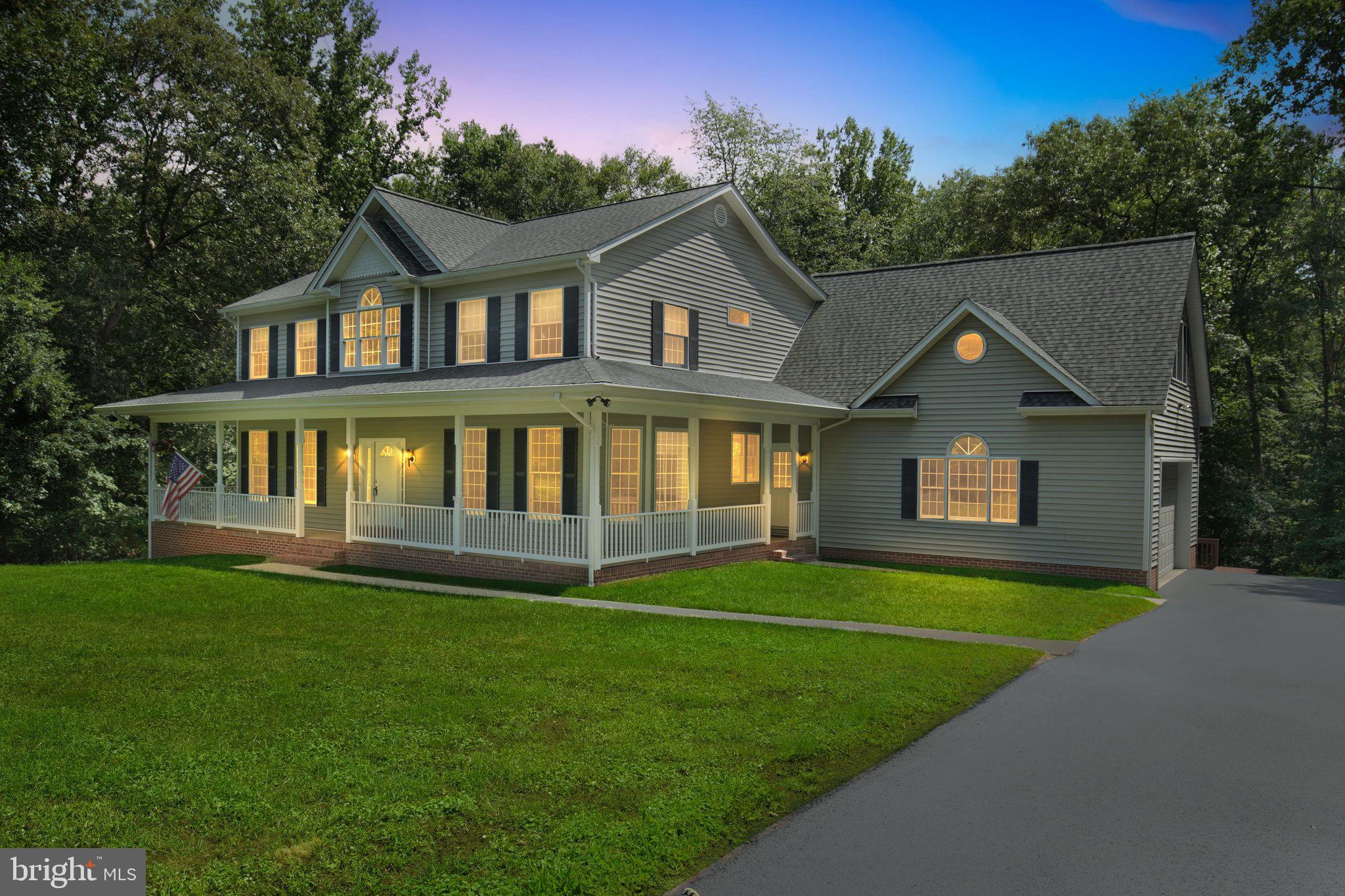 OPEN HOUSE: Saturday, August 16th from 1-3PM. Custom-built and impeccably maintained, this stunning 5-bedroom, 4.5-bath home offers over 4,300 sq. ft. of quality craftsmanship, featuring 2x6 exterior construction and thoughtful details throughout. The inviting wraparound front porch sets the tone, leading into a light-filled great room with soaring vaulted ceilings, a dramatic upper-level overlook, wet bar, and a cozy gas fireplace.
The spacious kitchen is a chef’s delight with beautiful quartz countertops, abundant cabinetry, cooktop, double oven, built-in pantry, and a breakfast area with bay window, plus a separate formal dining room. A piano room with built-ins and a second gas fireplace adds elegance, while the main-level in-law/guest suite with full bath offers flexibility.
Enjoy 9-ft ceilings on both the main and lower levels, and special touches like upper-level window ledge outlets for holiday décor. Outdoor living is a dream with a multi-level deck backing to trees on a serene 2.7-acre lot. Oversized 2-car garage, roof replaced in 2020, and a freshly sealed driveway complete this move-in-ready home.
