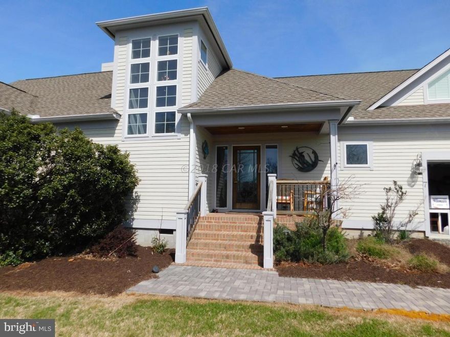 Beautiful custom built waterfront home with many extras including large eat-in kitchen (23x19) with stainless appliances & granite countertops. Experience amazing sunsets from every room & enjoy the beautiful views of the Annemessex River as you watch the local crab & fishing boats come and go.  Catch your evening meal from your private 400' pier w/boat lift.  Open concept with vaulted ceilings and large master bedroom on 1st floor with 2 walk-in closets and large tiled walk-in shower.  Enclosed porch, large wraparound deck, 2 car attached garage, stone gas fireplace & the list goes on & on.   This is a must see!!