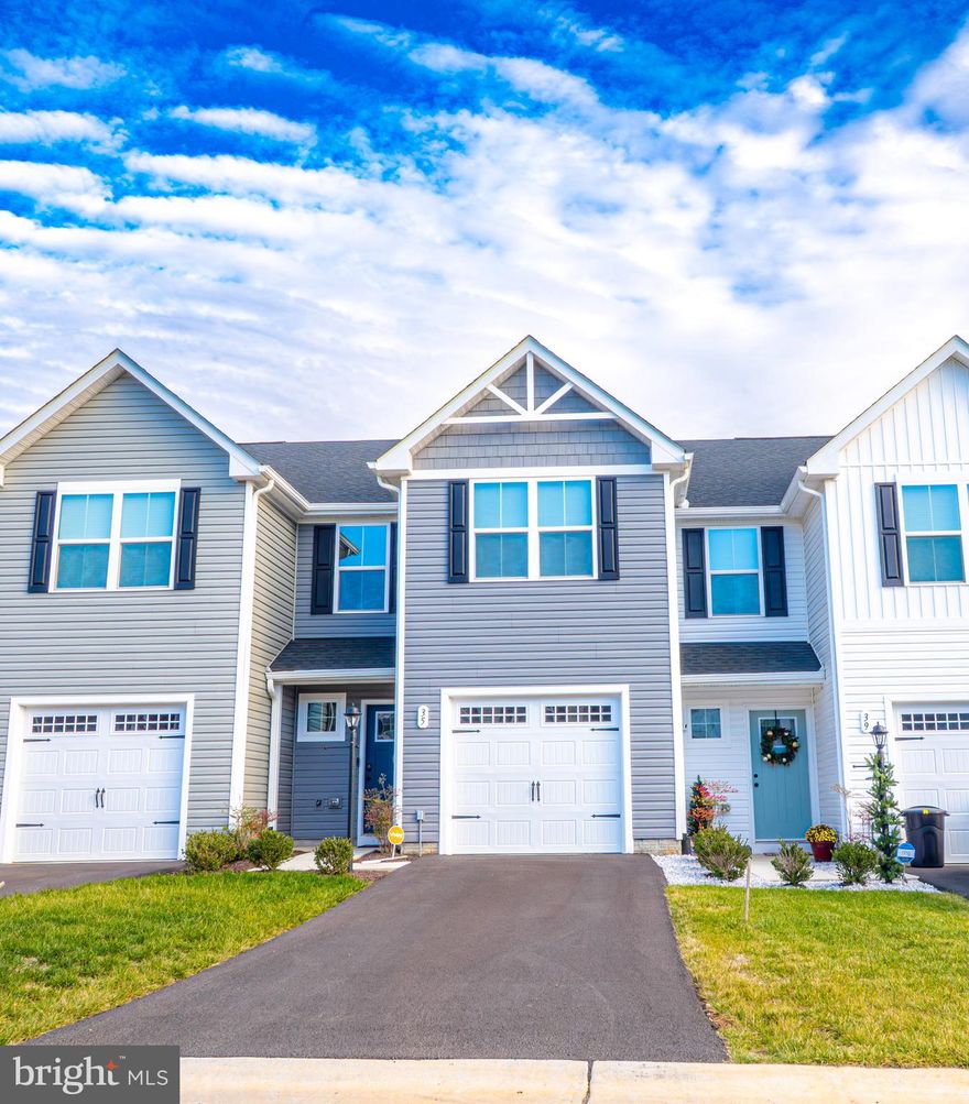 Why wait for new construction when you can move in now?? This meticulously maintained townhome was built in 2025, but the owner must relocate due to work. His loss is YOUR gain! This home features three bedrooms, two and a half baths, and a wonderful open-concept layout on the first floor. As you will see, the large family room offers ample seating space and opens up into the spacious kitchen, making it ideal for weeknight dinners or entertaining. Upstairs, the primary bedroom is ready for your personal touches! It boasts an en-suite bathroom with a double vanity and a walk-in closet. There are two more bedrooms upstairs, as well, and a hall bath that looks brand new! For ultimate convenience, the washer and dryer are located upstairs, too. Outside, you'll love having your own driveway - complete with a one-car garage that can be used for parking or extra storage space. This home is ready for you to make it your own! Get all the new construction amenities without the wait!! Schedule your tour today.