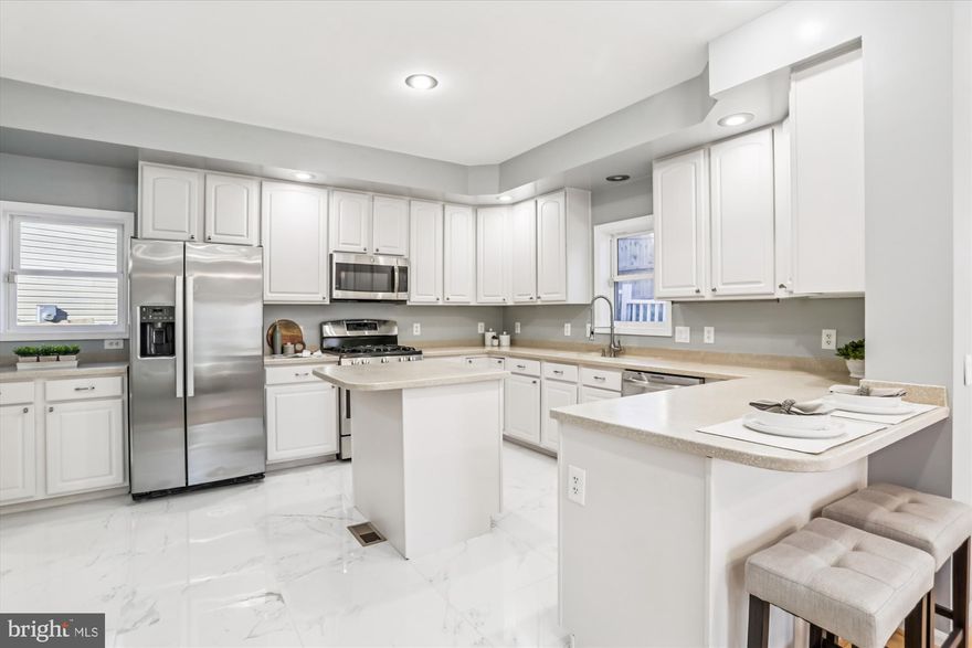 SO CLOSE TO TAKOMA PARK!  This lovely home has enough space to truly be comfortable and to stretch out!  4 bedroom, 3.5 bath colonial in a really nice location.  Minutes to downtown Takoma Park and the metro!  Shopping, restaurants, schools, transportation routes.  All within minutes.  Enter this home on the lower level where you will find a bonus room with double doors, a half bath, generous closet, utility room with laundry and entry into your finished and freshly painted two car garage.  The garage has ample storage also!  Move onto the second level where you will find the large, open and spacious kitchen.  The kitchen has plenty of cabinets and counter space!  New marble floors, fresh paint almost new fridge, etc.  This kitchen has it all.  Additionally there is an area you can use as a work space, an island, and a butlers pantry with additional storage and counter space.  Next to the kitchen you will find a comfy family room with gas fireplace and door to the exterior yard.  The dining room is spacious as well as the living room with plenty of light and windows.  The living space on this level is superior!  Take the stairs up to the next level and you will find the primary bedroom suite with attached bath.  The bedroom has two closets.  The attached bathroom has a nice soaking tub, walk-in shower and is beautiful.  The remaining three bedrooms and full bath complete the upper level.  The home has been completely painted and is ready for viewings.  Please call LA with questions.