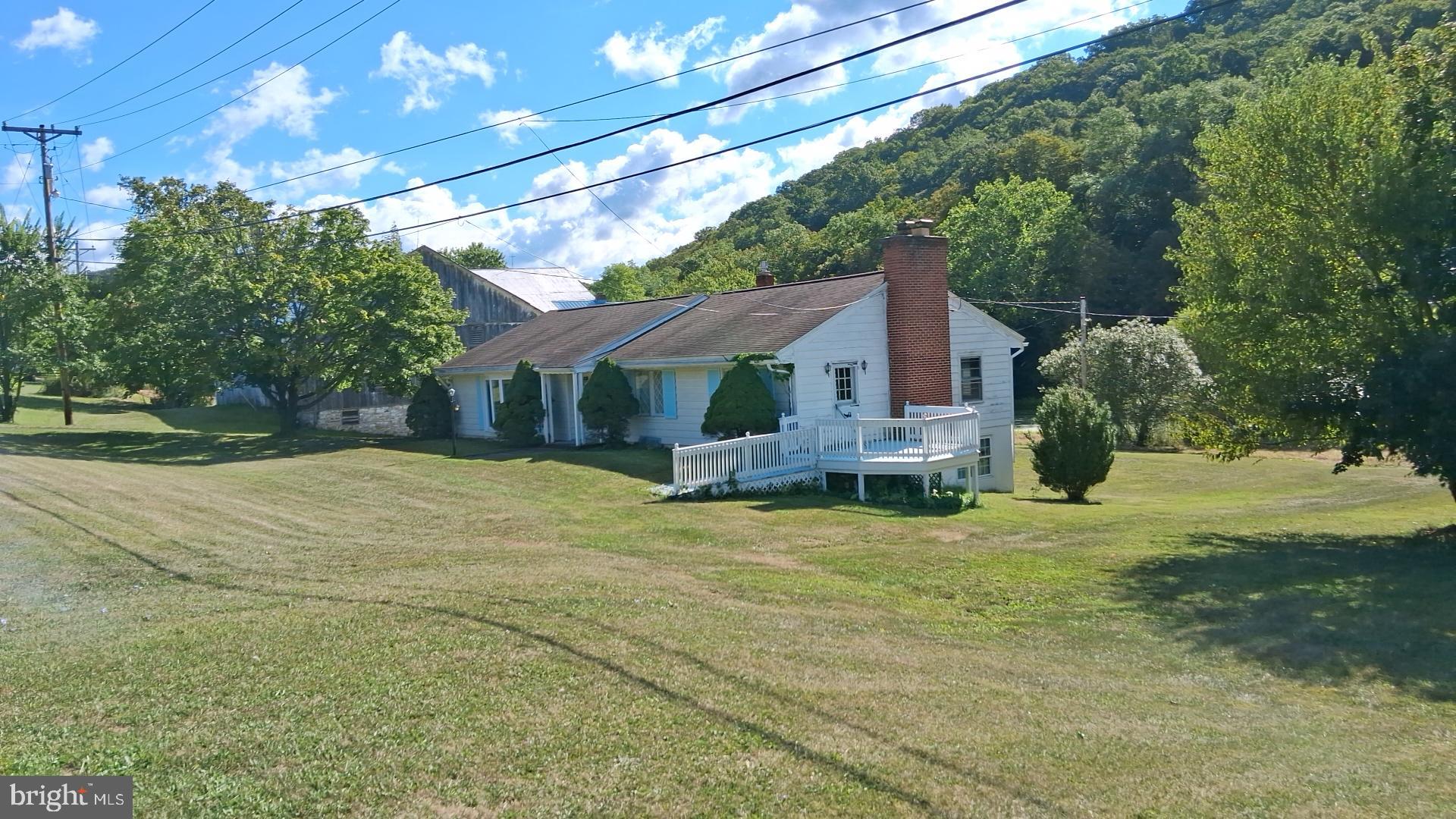 Come check out this property! Three bedroom, two and a half bath Ranch home in Bedford, PA. This home also offers a cozy brick fireplace, nice size kitchen and living room. Hardwood floors, 200-amp service. Two car garage under the home. 52' x 72' Barn with attached apartment. Very nice pond on the property. Just minutes to The Bedford Omni Springs and Historical Downtown Bedford, PA. Shawnee State Park is not far. Approximately 25 minuets to Rocky Gap Maryland. With some TLC you can make this home and property your own.