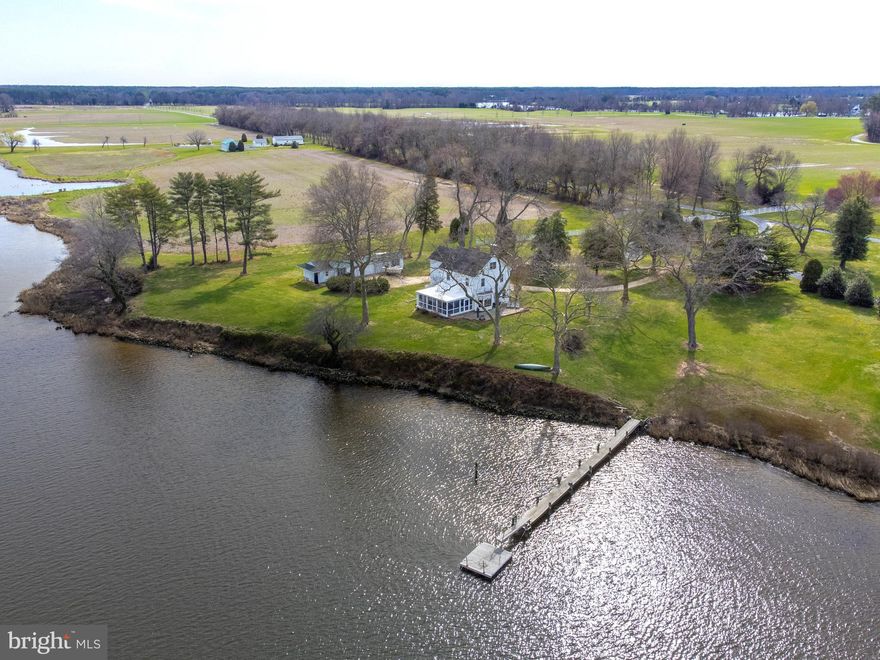 Welcome to this fantastic Eastern Shore classic sited on 2.35 private acres overlooking the Wye River with views of Wye Island. Northwestern facing and high elevation provide big skies and gorgeous sunsets. This charming home has 5 Bedrooms including the comfortable primary suite on the first floor. The beautiful kitchen and dining area have been renovated by the current owner and open to the living room and wonderful screened porch. River views are seen from nearly every room. The second floor has 4 nicely appointed bedrooms while the 3rd floor offers a bonus room and full bath.
Included is a detached 3 bay garage, workshop, and 2 stalls(used for storage).Beautiful sycamore lined drive in and road maintenance agreement in place.
Existing pier has 3'MLW however plenty of room to extend to 6+'MLW. In addition owner has permit in hand for new pool which would be located between the house and detached garage (offering water views).