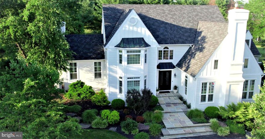 Welcome to beautifully renovated 9 Weatherfield Drive, offering 6,461 square feet of like-new living space. Designed by renowned architect, Ann Capron, this luxury old-world style provincial country home is nestled in highly desirable Weatherfield, an Upper Makefield estate enclave in historic Bucks County.   The owners have professionally fashioned an enhanced level of luxury to complement the salient architecture of 9 Weatherfield.  Built by renowned home builder, George Michael, 9 Weatherfield’s location within the scenic rolling hills and farmland of Upper Makefield provides a welcoming retreat-like setting.  Weatherfield Drive winds naturally through the estate community leading to a bend where the property driveway curves and rises slightly to the rustic Pennsylvania bluestone steps.   One enters through solid, well-crafted double Addison iron doors with operable double pane tempered glass inserts.   New polished Italian porcelain tiles grace an exquisite entry hall highlighted by classic style millwork and new black wrought iron balusters, complemented from above with a stately candle-style black tiered chandelier.  The theme continues into the adjacent living areas, all of which feature traditional, refinished natural red oak floors and the elegant custom millwork.   Quality of workmanship is present throughout.  Extensive remodeling includes new HardiPlank façade, smart home technology, exterior video surveillance system, new architectural roof, new windows with plantation shutters, in-law/au pair suite with second kitchen, gym and wine room. All baths are professionally enriched with upscale Restoration Hardware home fixtures and vanities.  Door hardware has also been upgraded.  Facing SW, the imperial roof lines and generous window sizes welcome you to neutral color palettes woven into a modern, bright and stunning interior design.  The tranquil, natural setting of 9 Weatherfield imbues a personal connection to the perennial cottage style gardens accessible through double French doors located off the Dining Room and Kitchen where one finds the added feature of a butler pantry transitioning both rooms.   Pleasant emotions are nurtured by natural daylight filling the home with cascading rays throughout. The kitchen offers granite countertops with under cabinet lighting on the perimeter.  An extraordinary quartzite island, accented with new Restoration Hardware lighting, is the focal point.  Both the Living Room and Family Room feature stately windows with plantation shutters and empire style columns which showcase the transition to their respective lower levels offering a sense of privacy and intimacy for relaxing in comfort.  Four fireplaces (MBR, LR, FR and in law/au pair suite) provide alternate sources for heat.  Stately windows with plantation shutters.  All projects, and there were many, have been completed using the finest materials and attention to detail.  Even the garage received special consideration with a new epoxy finished floor.  And by the way, the garage doors are extra wide for ease of parking recreational vehicles.  One can enjoy themselves with the comfort of knowing the home renovations are done, allowing for time better spent with family and friends.  Upper Makefield is recognized for the ambience of the local historic communities with riverside dining, farmland and parks.  9 Weatherfield offers close proximity for commuting to Princeton (30 min), Philadelphia (45 min) and NYC (90 min.). Air travel is serviced through Philadelphia, Newark and Trenton-Mercer airports. Elegant in design and presentation, with function where it matters most, move effortlessly into your beautiful like-new home in lieu of waiting on new construction.  9 Weatherfield Drive offers chic contemporary styling fashioned within the historic legacy of Washington Crossing.   Be sure to view the video presentation on this entire home, including stunning  evening footage!  Owners can settle quickly.