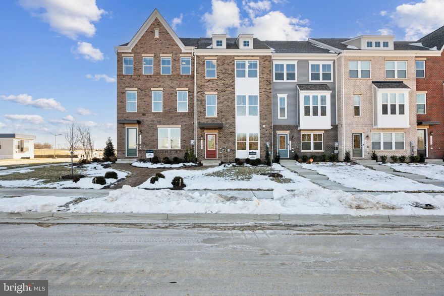 Discover the perfect blend of style, comfort, and convenience in this beautifully designed Jenkins townhome at Mill Branch Crossing in Bowie. Just minutes from Washington, DC, this vibrant mixed-use community combines the ease of city access with the charm of a thoughtfully planned neighborhood. Step inside to a two car rear load garage and a versatile lower level featuring Powder Room and coat closet. Whether used as a private guest suite, a home office, or a cozy media retreat, this space adapts seamlessly to your lifestyle. On the main level, you will find an open-concept Stainless Steel kitchen with quartz countertops, and a large island that anchors the space, perfect for casual meals or hosting gatherings. Flowing effortlessly from the kitchen, the expansive living room offers plenty of space for both relaxation and entertaining. A conveniently placed half bath adds ease and comfort for both family and guests. Just beyond, an oversized deck extends your living space outdoors, creating the ideal setting for morning coffee, quiet evenings, or lively weekend cookouts with friends and family. Upstairs, the owner’s suite is a true retreat with a spacious layout and a generous walk-in closet. The spa-inspired bathroom provides the perfect place to unwind after a long day. Two additional bedrooms offer comfort and flexibility for family, guests, or a home office. A conveniently located laundry room on the bedroom level accommodates side by side washer and dryer, making everyday routines simple and efficient. *Photos are of a similar model home. Ask about current closing cost incentives with use of our preferred lender and title

*Photos are of similar model*