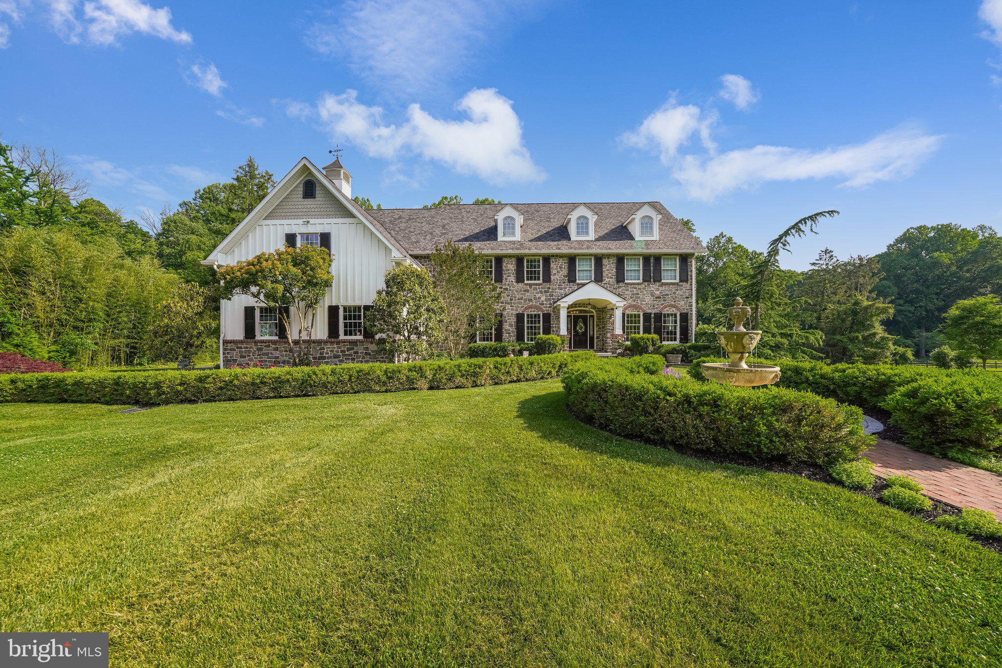 Welcome to 12 Raintree Drive that is situated next to a serene farm on a private cul-de-sac, this custom-built home is a haven of tranquility just off the PA/DE stateline and minutes from Greenville, DE. Located in the prestigious Unionville-Chadds Ford School District, this stunning home offers a harmonious blend of spaciousness, luxury, and privacy across nearly 6,300 square feet. With 6 bedrooms, 5 full baths, and 2 half baths, there is ample room for family and guests to indulge in comfort and relaxation. Immediately upon arrival you will fall in love with the breathtaking board and batten exterior with Head House shutters, highlighted by the immaculate landscaping, featuring a show stopping fountain and garden of roses. Follow the brick walkway to the inviting 3-lite grand entryway to be greeted by a massive foyer boasting gleaming Brazilian Cherry and Maple hardwood floors and lending access to your generously sized family room, half bath, double-doored office, and dining room. Enter through a wide archway into the gourmet kitchen equipped with a coffee bar, wine bar, stainless steel appliances, 6-burner gas stove, a kettle faucet, a walk-in pantry, 2 sinks, 2 dishwashers, a paneled refrigerator, and a huge island with an abundance of seating. Flow effortlessly into the bright open concept sunroom that provides access to your walk-off 15'x15' trex deck and overlooks your great room accented with a beautiful floor-to-ceiling stone fireplace. The main floor also features access to your large 3-car garage, a dropzone, a side entrance, a second powder room, an abundance of natural and recessed lighting, and detailed wainscoting. Make your way up either staircase to your spacious floor. Your owner’s suite oasis offers a lounge room, 2 walk-in closets, and an ensuite bath with an oversized 2-piece rainfall shower, stand alone claw-foot tub, water closet, and double sink vanity. The second floor is also made up of a convenient, tiled laundry room with utility sink, huge princess suite, jack & jill beds and bath, and 2 additional sizable bedrooms that share the full hall bath. Head to the newly finished lower level that was once used as an in-law quarters but is laid out perfectly to be used as a dual zoned space for whatever you need. This level is equipped with a modern kitchenette featuring granite countertops, a full bath with a separate private laundry. The lower level also offers a generously-sized unfinished portion giving you a plethora of storage space and access to the open and level tree-lined backyard. Even more storage space is available in a 2nd detached garage with its separate driveway. To add to the peace of mind this home has to offer, a new Certainteed premium roof was just installed March of 2023. The shutters, front door and siding were all recently painted in April of 2023. The downstairs furnace & AC units were replaced in 2021 and both hot water heaters were installed in 2019! Also included is a gas powered generator with an automatic switch over. Whether you are looking for the perfect home to disconnect and take in the idyllic scenery on the back deck or to entertain with the ultimate hangout this large, flat 2 acre lot offers countless opportunities to create the private outdoor hangout of your dreams. To top it all off, when you are ready to venture outside of your own private oasis you are just a short drive away from Biderman Golf Club, DuPont Golf Club, Wilmington Golf Club, Winterthur, Hagley, Longwood Gardens, and have easy access to the Route 52, 1, & 202 corridors. It’s time to check all of those boxes off of your wishlist, schedule your showings TODAY for the chance to make your dreams a reality.