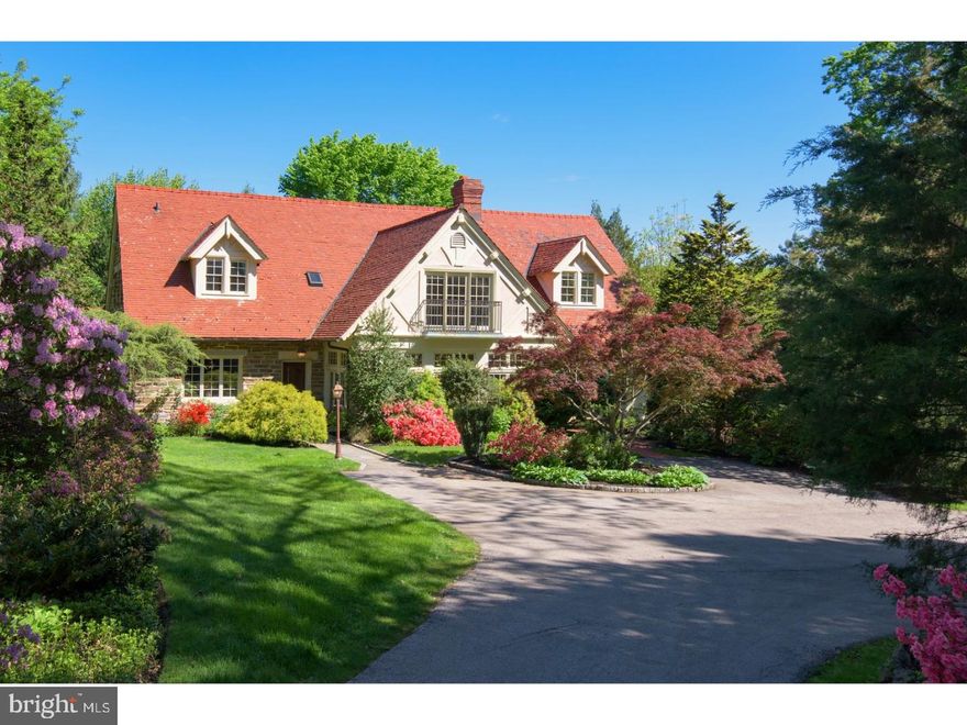 Owing its name to large rocks that are positioned by the front entrance of the Main estate, The Carriage House at Stonegate, The Grey Craig Farm, dates from the original land acquisition in 1898 to its completion as carriage storage in 1903.  Under the direction of a 19th restoration specialist, 1985 saw to the structure's residential conversion w/ a most recent but equally sensitive addition by the current owners in 2005. The result is an exciting 5-6 bed 5 1/2 bath home which retains the important truss & timbered open plan, 10 & 12 foot ceilings, exposed stone interior walls, Long Leaf Pine flrs & Southern Pine hand hewed overhead beams. The combination is an extraordinary parallel of old & new w/ the culmination of Kit & Breakfast Rm that seamlessly transition between the eras. A 2 story marble floored entry reveals both formal & informal space, highlighted on different levels so as create "rooms" within the open span.Handsome stone columns w/ mullioned French doors open to what was once an exterior terrace, finished w/ original Mercer Tile hexagonal flrs & now purposed as an office/conservatory overlooking the 125 foot cobble edged drive, well planted front court & arrival circle. Flr to ceiling oil finished walnut cabinetry grace the one wall of the LR while focus is brought to an alternate exposure w/ a carved European styled wood burning fireplace. The elevated DR provides connection to the informal FR & beyond to what was once reference as an Artist Studio, now a large laundry, storage, full bath & outside entrance w/ the possibility of an update to allow for a 6th Bdrm/In-Law suite. Utilizing the design & construction team & talents of Archer & Buchanan & Orion Construction, the home was expanded in the most meaningful of ways w/ a 3 story South Eastern facing addition which includes a spectacular eat-in Kit w/ oversized, marble topped prep & seated island, BR, below a walkout to pool, finished recreation rm w/ beautifully detailed & selected full bath & secondary laundry. On the 2nd flr the addition provides for a deluxe Master suite w/ 3 walk in closets, French Limestone bath w/ jetted under window tub, seamless glass shower & balcony overlooking the pool & private gardens. 4 addl family or guest bdrms & 2 full baths, one w/ shower the other w/ tub are enriched w/ hardwood flrs & excellent storage.Rich in history detail & charm, positioned at the end of a quiet cul de sac in sought after TE. As welcoming a home as you will find.