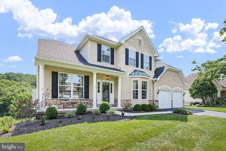 Welcome to your dream home in the highly sought-after, active 55+ community of Traditions at Inniscrone! This stunning property offers a wealth of luxurious features and an unbeatable location. The formal living room boasts crown molding and a lovely view of the front yard. Adjacent to the living room, the elegant dining room also features crown molding and a bay window. The family room has two story ceilings, new carpet, and provides a cozy ambiance with a gas fireplace as the focal point. Step out onto the low maintenance composite deck with an awning to enjoy the wooded open space and large private yard. The updated kitchen features granite countertops, stainless-steel appliances, and a Bosch dishwasher. The main floor primary bedroom offers hardwood floors, a vaulted ceiling, and a walk-in closet. The en suite bathroom includes a double vanity, soaking tub, and glass-enclosed shower. Upstairs, find a loft area, a second bedroom, and a full bathroom. The finished basement features a bar, TV/game room, theater room, patio access, half bathroom, workshop, small office, and storage. The home also includes a whole house generator and newer roof, hot water heater, and HVAC. The neighborhood is perfect for low maintenance living and has a club house with a pool.  Welcome Home!