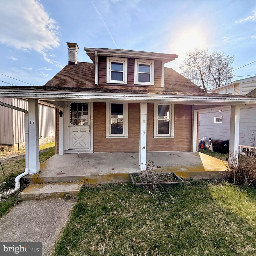 This charming 1.5-story Cape Cod offers a great opportunity for buyers looking to add their personal touch. Featuring 2 bedrooms and 1 full bath, the home boasts a spacious living room perfect for relaxing or entertaining, along with a cozy eat-in kitchen ready for your updates and vision.

The layout includes one bedroom on the second floor, providing added privacy, while the main level offers convenient living space along with a practical mud room—ideal for keeping things organized year-round.

Step outside to enjoy a private rear deck overlooking a fenced-in yard, perfect for outdoor gatherings, pets, or gardening. The property also includes a detached 2-car garage with rear access, plus a side driveway on the left side of the home for additional off-street parking.

This home does require updating and repairs, making it a great option for investors, renovators, or buyers seeking to build equity. Located in a flood zone, buyers are encouraged to perform their due diligence and explore insurance options.

Bring your ideas and unlock the potential this property has to offer!