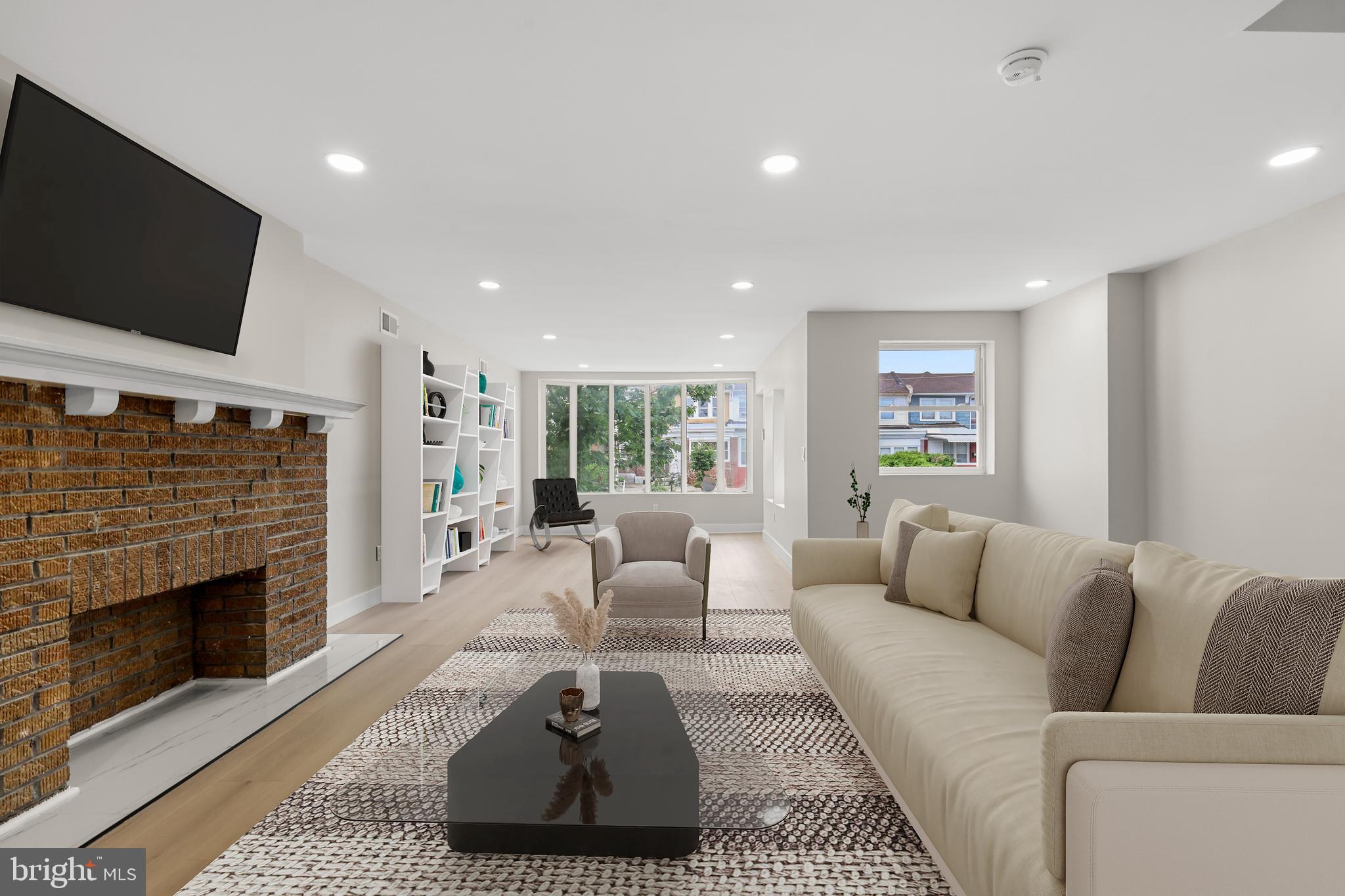 Welcome to a fabulously renovated home in West Oak Lane, a Philadelphia Neighborhood. We start off our tour by entering the home from 67th Ave into a nice welcoming room where you or your guests can hang coats and drop shoes. This space can be a great sitting area with a nice bookshelf to setup your home library where you can pick up a book and read by the front bay window. Next we walk into the huge living room that has enough space for a formal living area and a tv area - essentially two living rooms in one. If we keep going towards the rear we pass through the opening that leads you into a massive kitchen with plenty of storage within your modernized cabinetry that looks and feels like leather panels. The countertops are marbled quartz with matching backsplash for that luxurious look you find in million dollar homes. The kitchen area is so large that in addition to the oversized island where 4 people can sit very comfortably BUT you an also have an 8 person dining table setup. Family dinners here will be amazing! Just when you thought the dining area is finished you realize there is a wooden deck just off of the kitchen where you can eat el fresco or get your BBQ on. After checking out the kitchen let's take the stairs down to the fully finished basement. This basement is setup for a second living room area that can either be a home theater space, a gaming room with a few foosball tables or pool table. The basement is also setup with a full sized bathroom - so even guests could stay in the basement. We can then access the rear entrance at the basement and the 1 car garage. Not only can you park a car in the garage space there is additional space behind the garage outside where you can park a second car and if you're adventurous you can park a 3rd smaller compact car under the deck. Finally, let's go check out the second floor where the bedrooms are located. As we get to the top of the stairs if you go towards the front of the home you will pass by the large hallway shared bathroom that resembles something from a luxury hotel chain. Just past the hallway bath is the main bedroom with a detailed accent wall ready for you king sized bed setup. Across from the bedroom wall is the entrance to the full sized owner bathroom with shower stall setup. Now let's head down the hallway towards the rear and we will see the two side by side queen sized bedrooms. Schedule your appointment today - homes with garage parking go quickly!