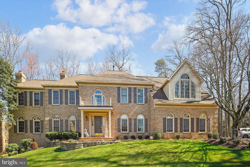 This stately Colonial home in Fairfax Station is situated on a gorgeous 2/3-acre lot, is on Public Water and Pubic Septic and offers elegance, space, and modern updates throughout. Boasting 6 bedrooms and 5.5 bathrooms, this former model home provides gracious living on three finished levels.

Step into the grand two-story foyer, featuring a curved staircase and leading to formal living and dining rooms, a butler’s pantry, and a huge contemporary remodeled chef’s kitchen with stainless steel appliances, white cabinetry and granite countertops. The adjoining breakfast room is surrounded by windows and opens onto a large deck overlooking lush greenery, ideal for outdoor entertaining. The spacious family room, complete with a cozy fireplace, also provides access to the deck. A sun-filled conservatory offers a perfect flex space for a home office, yoga studio, or music room. Additional main-level features include gleaming hardwood floors, a powder room, and entry from the three-car garage.

The upper level offers four generously sized bedrooms and three full bathrooms. The huge primary suite is a dream, featuring a dramatic vaulted ceiling, dormer windows, and a massive walk-in closet. The primary bath boasts dual vanities, a soaking tub, a separate shower, and a private toilet room. One secondary bedroom has its own en suite bath, while two additional bedrooms share a hall bathroom. For added convenience, there is an upstairs laundry room.

The fully finished walkout basement is designed for both relaxation and entertainment. It includes a large recreation area, 2 bedrooms and 2 full bathrooms, one of which is a 2nd master suite, basement washer and dryer and a sauna for ultimate comfort. Walkout access to a lower-level patio add to the appeal.

This home has been meticulously maintained and thoughtfully updated with tons of trim, built-ins and storage.  Ages of major systems: Roof (2024), dual-zone HVAC (upstairs 2024, downstairs 2012), hot water heater (2014), new stovetop (2024), oven (2023), hardwood on upper level added (2021). All the upstairs and main level windows have been replaced.

Located in a peaceful yet convenient neighborhood near the Country Club of Fairfax, this home offers easy access to major commuting routes, including Fairfax County Parkway, I-66, I-95, and I-495. The Burke Centre Train Station, Express Metro Bus (Route 18P) to the Pentagon, and VRE are all nearby. With Burke Lake Park and trails, shops, dining, and entertainment just minutes away, this exceptional home provides both privacy and prime location convenience. Don’t miss this incredible opportunity to own a beautifully updated home in Fairfax Station!