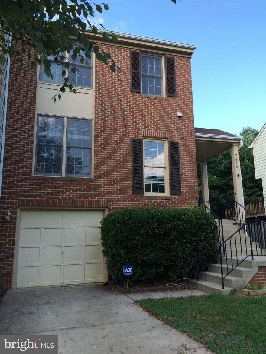 Bright & open end-unit townhouse, one car garage, backed to trees. Updated gourmet kitchen w/breakfast area opens to a large deck to enjoy & entertain. Double sink in master bathroom, new carpet, laminate flooring, full size washer/dryer, basement walk-out to a patio & private fenced backyard. Cul-de-sac, extra parking, pool, tennis, tot lot, & more at Woodstone! Move-in ready! Small dogs OK!