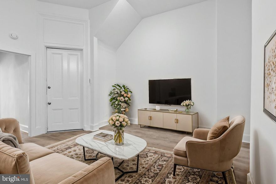 Experience the perfect blend of historic charm and modern luxury in this stunningly renovated 2-bedroom, 1-bathroom apartment! Situated within a beautifully preserved historic building in the vibrant Franklin Square neighborhood, this unit offers a unique and sophisticated living experience.Step inside and be captivated by soaring 12-Foot Cathedral Ceilings, Creating an open and airy atmosphere throughout the apartment. Elegant Hardwood Floors,  Flowing seamlessly through the living spaces, adding warmth and character. Gourmet Kitchen: Featuring massive kitchen island that can seat 4, sleek gray stone counter-tops, stylish two-tone cabinetry, and classic subway tile backslash.  Breathtaking View of Franklin Square Park Enjoy picturesque views right from your from your bedroom,large wooden historic shudders providing a tranquil escape in the heart of the city. Modern Bathroom with Newly designed with contemporary fixtures and finishes. This unit has off street parking and a separate parking pad. This prime location offers and unbeatable commute.  Just 10 minutes to the bustling Downtown Baltimore, the excitement of Camden Yards, the vibrant atmosphere of Hollins Market/Washington Village, and easy access to I-95. Historic Charm of Franklin Square to Immerse yourself in the rich history and beautiful architecture of this desirable neighborhood. Easy Access to Amenities to enjoy nearby restaurants, cafes, shops, and cultural attractions.