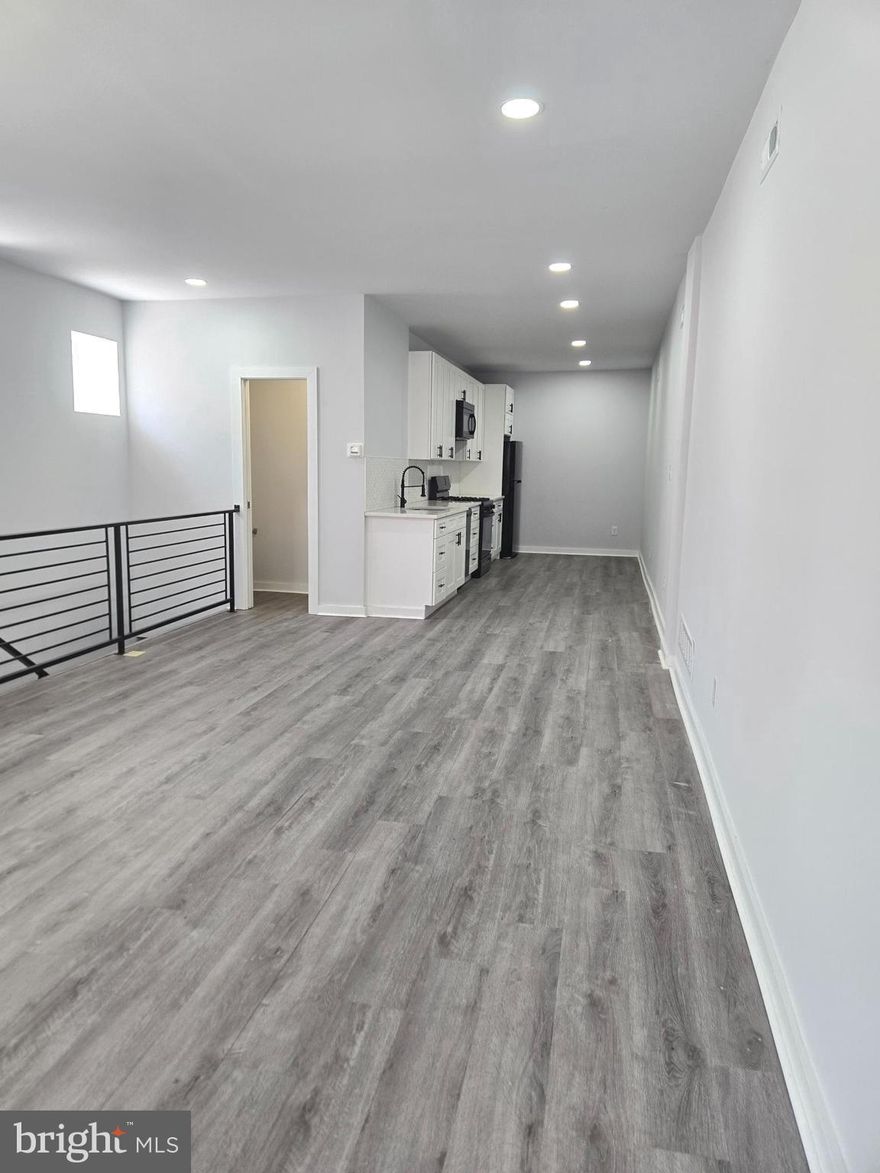 Spacious 2 bed, 2.5 bath bi-level apartment in the heart of Olde Kensington with 1-car GARAGE PARKING! This bright corner unit offers 1,300 sq ft of living space with an open layout, modern kitchen, and a convenient half bath on the main floor. The lower level features a second living area, in-unit laundry, and two bedrooms—each with a private full bath and generous closet space. Pet-friendly with fees. Steps from Reanimator Coffee, Helm, and close to Fishtown, Northern Liberties, and public transit. All square footage numbers are approximate and should be verified by the buyer. It is the responsibility of the buyer to verify real estate taxes.