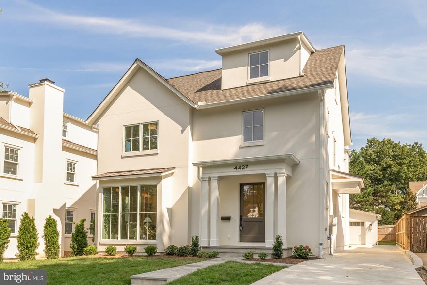 Welcome to 4427 Ridge Street, a stunning new construction home in the heart of the Town of Chevy Chase, brought to life through a prestigious collaboration between GTM Architects, Terra Innovations, and Castlewood Custom Builders. Blending classic charm with modern luxury, this four-level residence offers five bedrooms, four and a half bathrooms, and a detached garage with an EV charging outlet, all on one of the most desirable streets in the neighborhood.

The home’s curb appeal is immediate, with a stucco exterior, a natural cleft flagstone walkway, and a covered front porch, all of which lead into an interior defined by timeless design and exceptional detail.

The main level impresses with 10-foot ceilings, select 5” white oak flooring, and bright, open spaces that transition effortlessly from formal to casual living. The family room, anchored by a dramatic 42” Accelerator wood-burning fireplace with herringbone refractory lining, opens to a flagstone patio and covered rear porch, creating a seamless indoor-outdoor experience.

At the heart of the home, the gourmet kitchen is a showpiece, featuring Woodhaven custom inset cabinetry, sleek quartz countertops, and a premium appliance suite including a Lacanche 43.5” range, 30” integrated refrigerator, 24” integrated freezer, Bosch custom-panel dishwasher, and Sharp drawer microwave. A walk-in pantry offers ample storage—and is just waiting to be filled with favorites from Trader Joe’s, conveniently located just two blocks away. A sunny breakfast nook with views of the backyard and a formal dining room perfect for entertaining complete this level.

Also on the main floor, a versatile office/guest suite is tucked away for privacy,  making it ideal for visitors or remote work.

Upstairs, the second level features 9-foot ceilings and a luxurious primary suite with dual walk-in closets and a spa-inspired bath complete with a soaking tub, oversized shower, and double vanity. Two additional bedrooms, a stylish hall bathroom with double sinks, and a laundry room designed for convenience round out this floor.

The third level loft offers flexible living space, another bedroom and full bathroom—ideal for a playroom, guest suite, or creative studio.

The fully finished lower level includes a generous recreation room, fifth bedroom, full bath, and dedicated home gym with rubber flooring, plus walk-up access to the backyard.

Every detail has been thoughtfully considered—from the Jeld-Wen Siteline casement windows that bathe the home in natural light, to the designer lighting throughout, and the quality finishes that define this extraordinary property.

Just blocks from downtown Bethesda, Metro, neighborhood parks, and top-rated schools, 4427 Ridge Rd is a rare opportunity to own a custom, architecturally significant home in one of the most sought-after neighborhoods in the region.

Schools:
- Rosemary Hills ES (PreK-2nd)
- Chevy Chase ES (3rd-5th)
- Silver Creek MS
- Bethesda-Chevy Chase HS