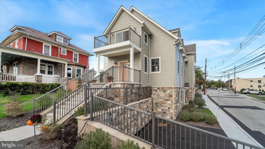 Just one block off Ambler’s iconic Butler Avenue, The Colony Club features two luxury new-construction homes. Originally built in 1912, this Ambler landmark has been completely transformed, preserving its timeless character while delivering the quality and sophistication of brand-new construction. Once home to a vibrant social club and later a library and community gathering place, the building has been thoughtfully reimagined to honor its architectural roots while offering every modern amenity.

The builder’s craftsmanship is evident from the start, beginning with the lifting of the original structure to install new foundations and a lower-level living space. All components were newly installed in 2024 and 2025. 

Unit A welcomes you with timeless curb appeal. The classic front staircase leads to a covered porch, the perfect perch to enjoy the charm of Ambler’s tree-lined streets. Step inside to a gracious foyer that opens to the Great Room, where gleaming solid oak engineered hardwood floors set the tone for the quality and detail throughout. The main level offers a bright, open layout with large windows, a gas fireplace, built-in bar, recessed lighting, and a designer kitchen with shaker cabinetry, granite counters, stainless-steel appliances, and a farmhouse-style island. A stylish half bath with a pocket door completes this level.

Upstairs, the primary suite feels like a true retreat, featuring hardwood floors, an 11-foot tray ceiling, multiple walk-in closets, a spacious sitting area, and a spa-inspired en suite bath with dual vanities and a walk-in shower. Step onto the private west-facing balcony—the perfect place to unwind and take in sunset views over Ambler’s skyline.

The lower level provides two additional bedrooms, a den, a full bath, and a laundry room with walk-out access to two private off-street parking spaces. Green features include insulated concrete form (ICF) foundations, VRF HVAC systems with room-by-room climate control, LED lighting, closed-cell spray foam insulation, and the upcycling of original materials.  Steel-beam reinforcement, and all-new systems make this home a rare blend of historic beauty and modern comfort, just steps from downtown Ambler, SEPTA, and award-winning Wissahickon schools.

The Colony Club offers a rare opportunity to own a piece of Ambler’s history, fully renewed for today’s lifestyle—a truly one-of-a-kind home where character, craftsmanship, and comfort come together beautifully.