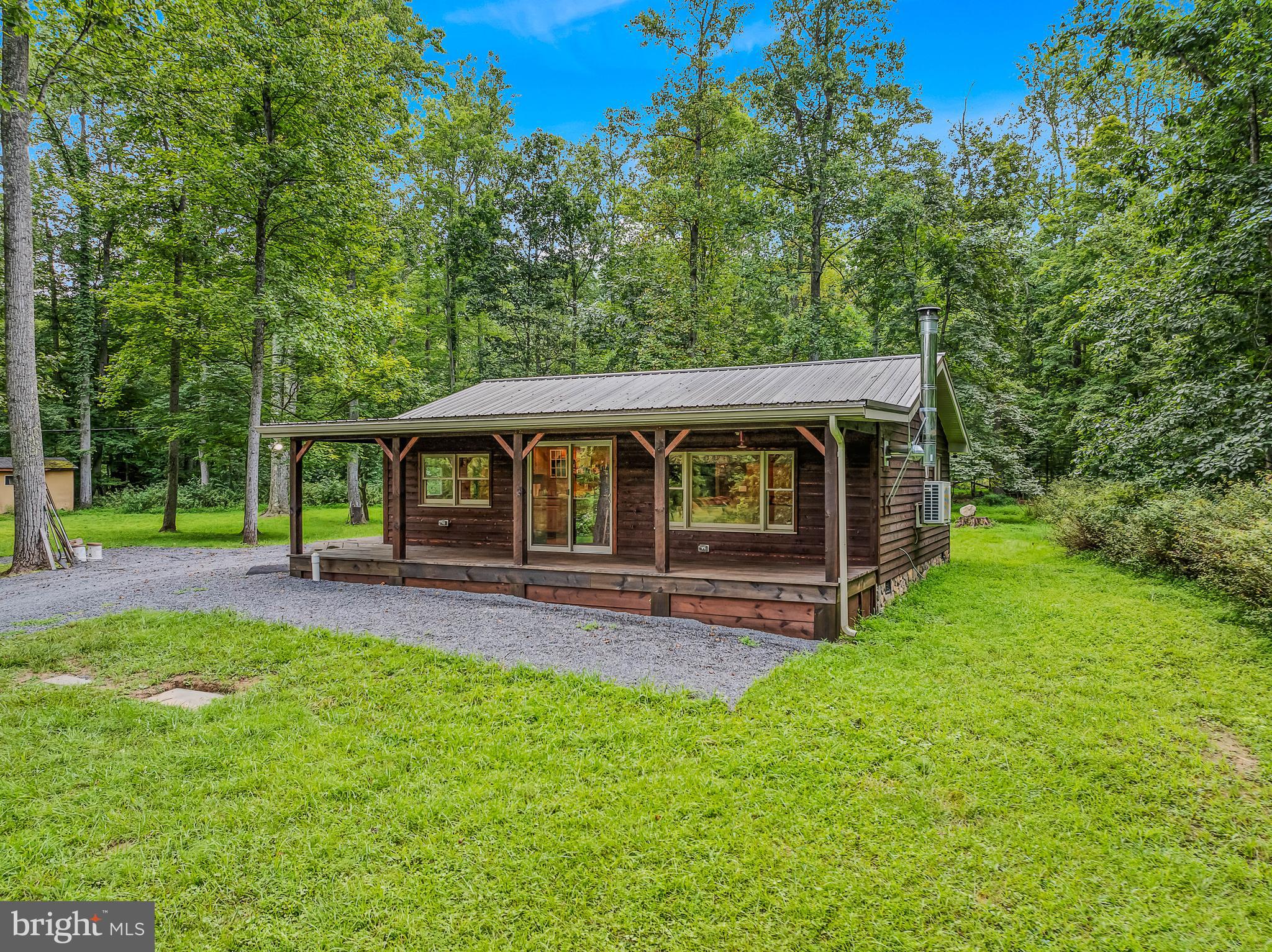 Newly remodeled water front cabin is ready for your retreat enjoyment. Perfect tranquil getaway offers two bedrooms, Great Room Kitchen and Living Room combo and spacious front porch overlooking the serene and scenic view of the Cacapon River. Wood walls and ceilings, full bath with easy access shower and double sinks. Close to the river’s edge to enjoy swimming, fishing, tubing, kayaking and more. Relaxation awaits your family and friends to savor the natural beauty of the region seamlessly blending the peace of the rural location. Vacationing at this lovely property can be yours for $298,900. Don’t miss out on this rare opportunity. Contact your favorite Realtor to arrange a private showing.