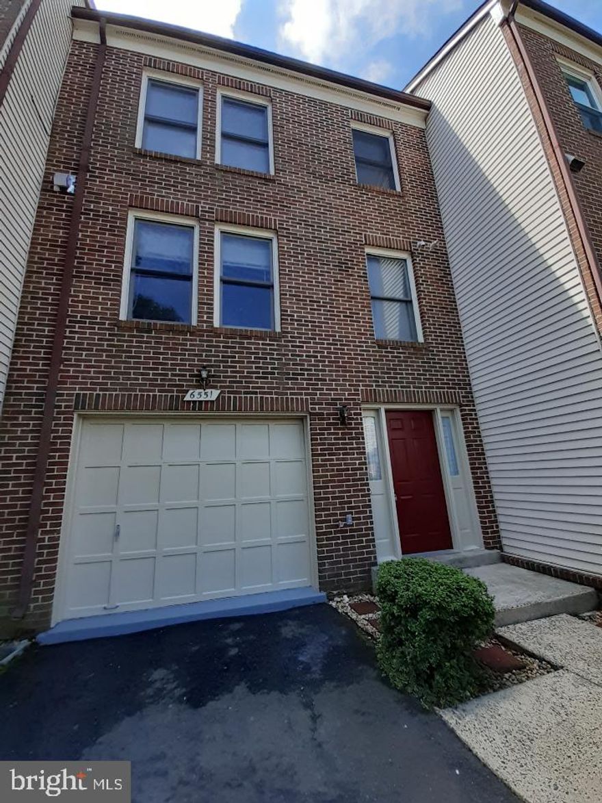 Contemporary Brick Front Garage Townhouse with 3 Bedrooms, Loft and 3.5 baths. Large foyer entrance leads to large living room with cathedral ceiling, wood burning fireplace and direct access to balcony on main level. Stairs to dining room with open counter/bar leading to an updated and bright kitchen, cabinets, recessed lights, stove/gas range, and kitchen appliances and a hallway to a half bath.  On level three, a hallway separates two bedrooms, a full bath, laundry closet with washer/dryer, and a large main bedroom with cathedral ceiling, large closet, full bath, stairs to loft, Loft with ceiling fan/lights and large storage/closet. On lower level, large room with closet/storage, full bath/shower and direct access to fenced patio/deck.  Townhouse close to restaurants, shopping, public golf course, Green Spring Gardens, commuter facilities/routes/transportation, points of interest: Washington DC, Old Town Alexandria, and others. Pinecrest offers residents access to tennis and basketball courts, tot-lots, walking trails, and pond.