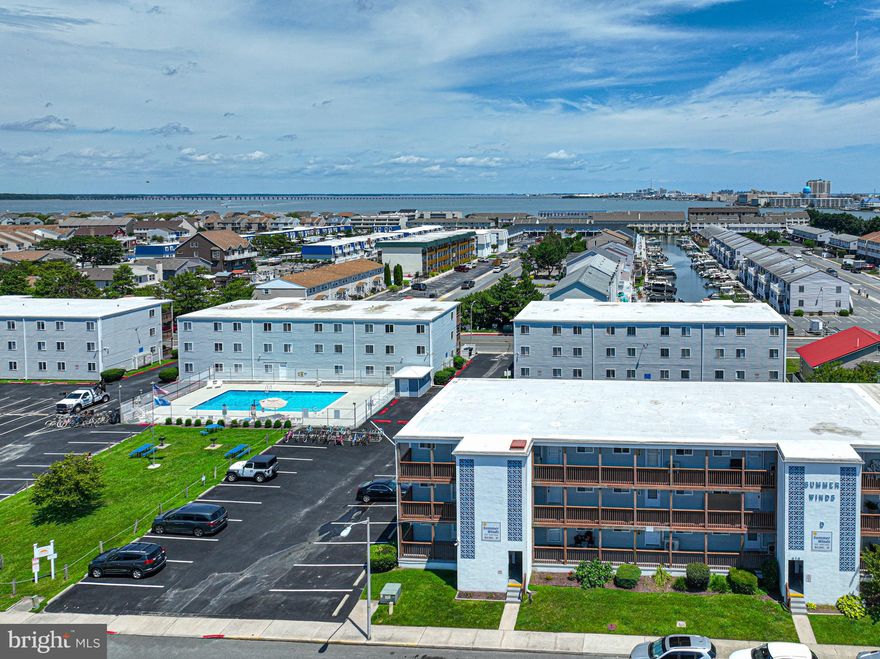 Welcome to Summer Winds, a beautifully updated two-bedroom, one-bathroom condo in the heart of Ocean City, Maryland. Situated in a prime first-floor location, this unit offers easy access to a wide range of desirable amenities and attractions, making it the perfect coastal retreat.

The interior of the condo boasts freshly painted drywall, new craftsman trim, and all-new doors, complemented by wall-to-wall vinyl plank (LVP) flooring. The property has undergone significant upgrades, including a new hot water heater installed in 2023, an updated electrical panel, and a brand new three-head Pioneer mini-split system that was professionally installed and permitted. Convenience is further enhanced with a stackable washer and dryer.

The kitchen has been transformed with stunning new granite countertops, an elegant tile backsplash, all-wood construction cabinets, and modern lighting throughout. The bathroom has also been updated with a brand new vanity and toilet, ensuring a fresh and contemporary feel.

Additional features include newer windows throughout the unit, mounted flatscreen TVs in each room, and a separate owner’s closet. The condo is sold completely furnished, with the exception of a few personal items, allowing for an effortless move-in experience. The Summer Winds community offers a beautiful pool, perfect for family enjoyment and relaxation.

This turnkey property is ready for you to move in and start enjoying all that Ocean City has to offer. Don’t miss out on this opportunity to own a piece of the beach. Schedule your viewing today!