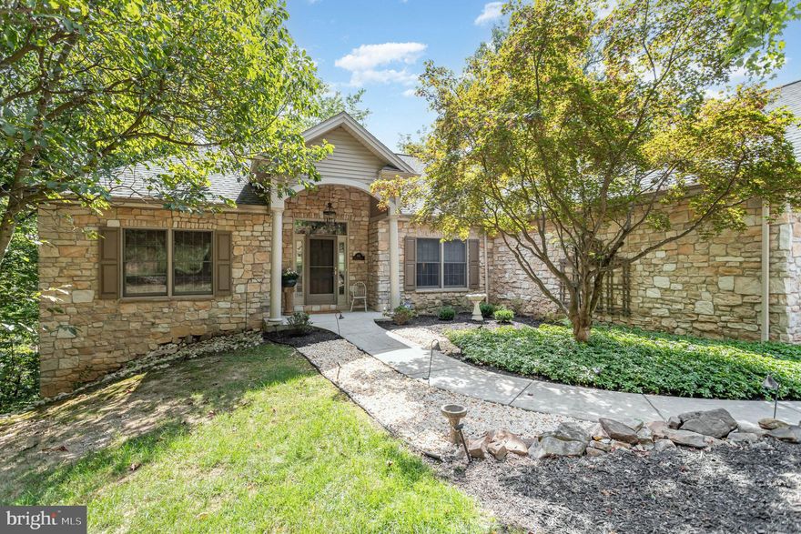 Welcome to this beautiful ranch home nestled on a .61-acre lot in the desirable Mountaindale community! Step inside to find an inviting foyer that welcomes you into the main space of the home with wonderful features throughout. The formal dining room is complete with hardwood floors, crown molding, and chair rail. The open living room features soaring 12-foot ceilings, hardwood floors, skylights, expansive windows that flood the space with natural light, and a double-sided gas fireplace that flows seamlessly into the kitchen area. The kitchen is a chef’s dream with quartz countertops, tile backsplash, center island, skylight, eat-in dining area, and sitting space with outdoor access.  Private office with hardwood floors, and custom built-ins/desk. The main-level primary suite offers deck access, hardwood floors, tray ceiling, walk-in closet, ceiling fan, and a luxurious bath with double vanity, walk-in shower, and soaking tub. An additional bedroom is also found on the main level. The finished walkout basement with 9-foot ceilings provides the perfect setup for guests or in-law quarters, featuring its own kitchen, family room with gas fireplace, two additional bedrooms, full bath, and laundry hookups. Basement also includes over 1,150 sf of unfinished space for storage. Outdoor living is at its finest with two decks overlooking beautiful wooded views, offering a true “living among the treetops” experience. Two car garage and spacious driveway. Convenient access to shopping, dining and entertainment. A joy to own!